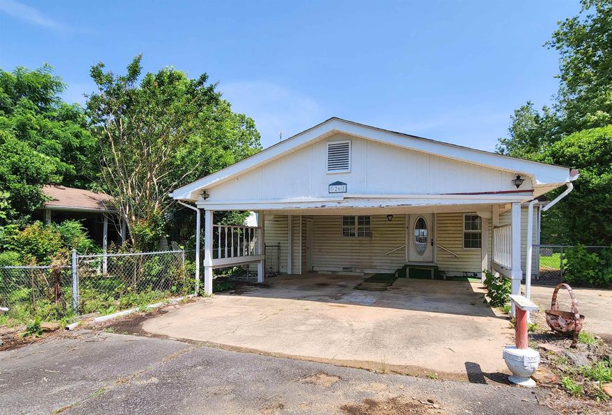 Great starter home sitting on a half acre lot and close to Hwy 65. This 2 bedroom home has a large living room a carport and and storm shelter. Sold as is. Agents see confidential remarks.