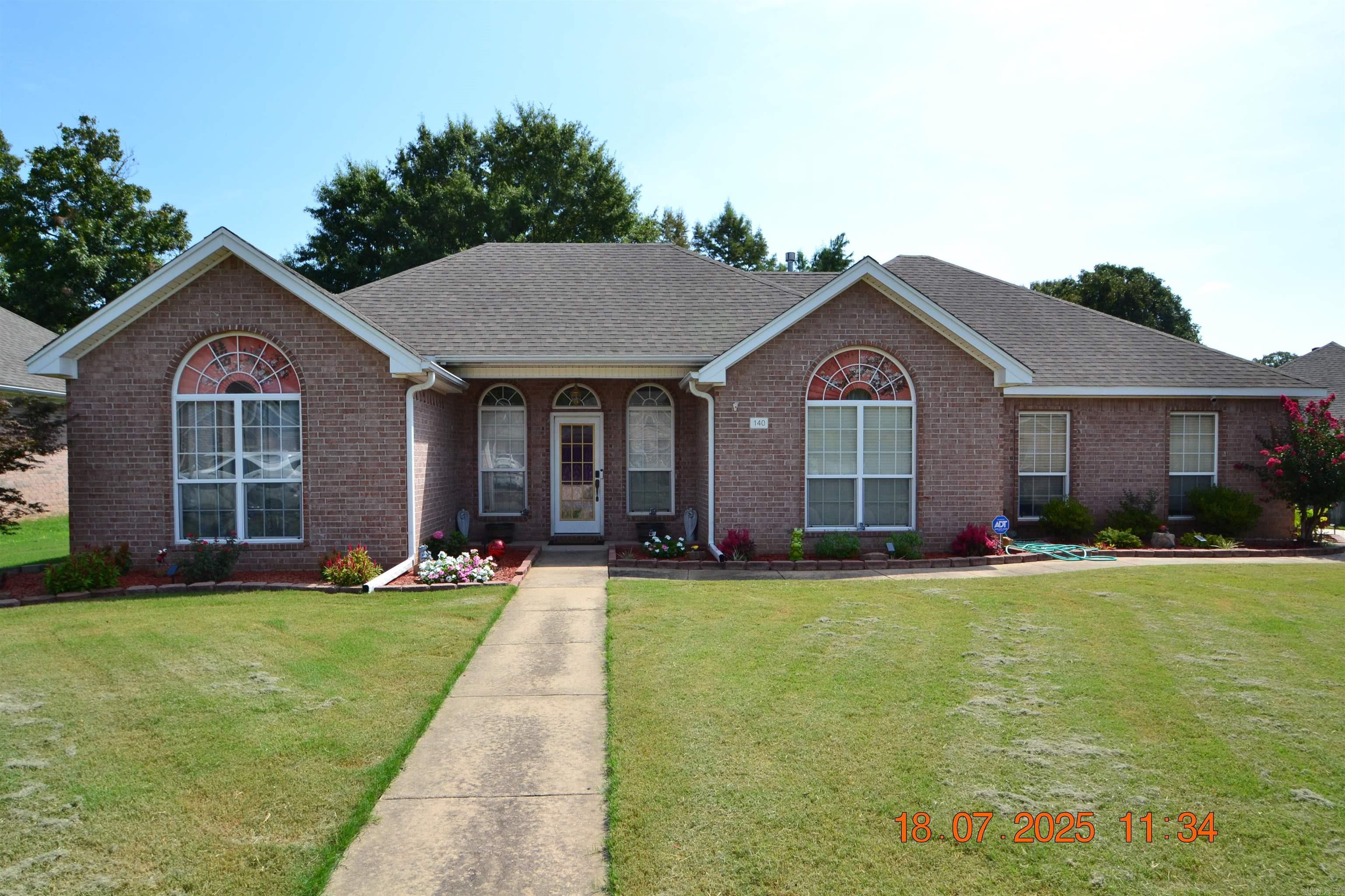 Great neighborhood with well kept homes. This home offers a large great room w/fireplace, tray ceiling & luxury vinyl flooring. The kitchen has lots of cabinets, breakfast bar, pantry & tile flooring. A handy laundry room is just off the kitchen. Enjoy special occasions in the formal dining room which has a cathedral ceiling, chairrail & a stunning arched window. In the primary bedroom suite, you will find a tray ceiling, carpet & ceiling fan. The adjoining bath has a separate shower, corner jetted tub, double vanity, linen storage & walk in closet. Two additional bedrooms are separate from the primary bedroom. One bedroom has an arched window & cathedral ceiling. Both have double closets. A hall bath separates the two bedrooms. The backyard is fenced and has a nice patio. An end entry garage allows for more parking and adds to the street appeal of this lovely home.
