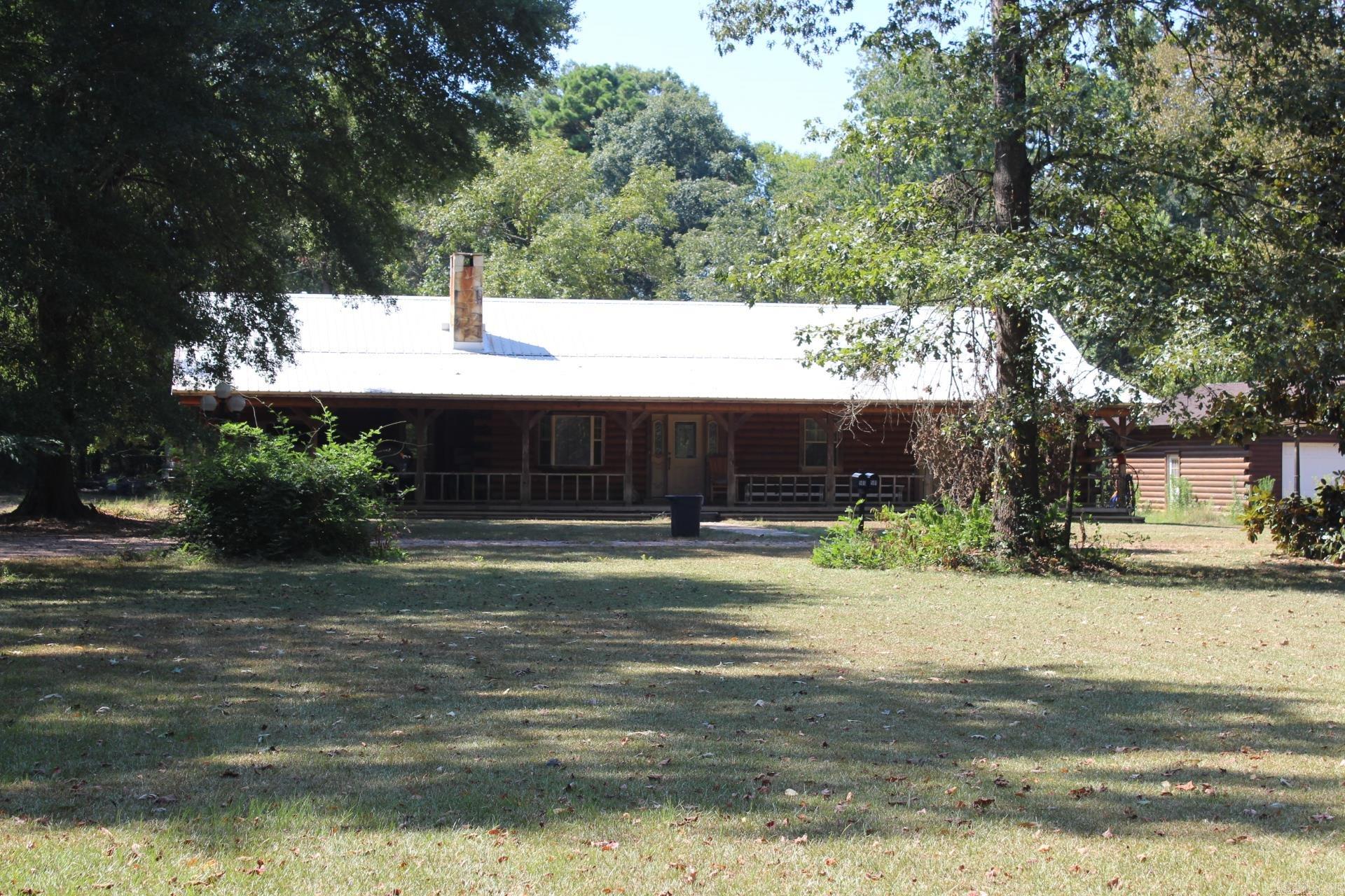 3 Bed, 2 Full Baths with approx. 2088 Sq. Ft. of living space LOG Home situated on approx. 10 acres. Large kitchen features lots of storage, Island and wood flooring. Spacious family area with a woodburning fireplace and built-ins. Large walkin closet. Laundry area features lots of storage, great work space with sink. Home has a 2 car attached carport and a detached 2 car garage. Central AC/Heat was replaced in 2024. Property has a 1960 sq. ft. shop.