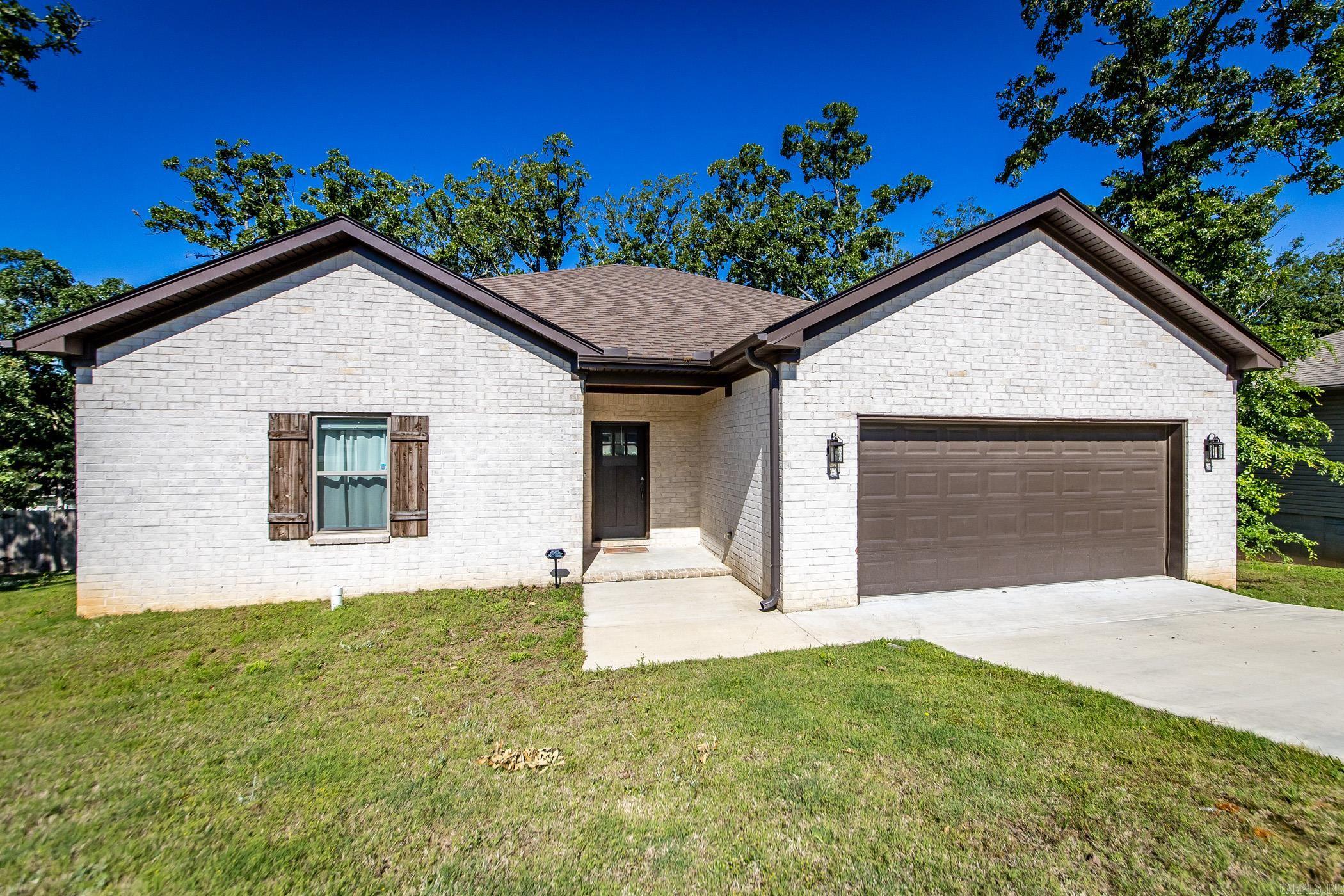This newer 3-bedroom, 2-bath home features an inviting open floor plan where the living room flows seamlessly into the kitchen—perfect for everyday living and entertaining. The kitchen boasts a large island, walk-in pantry, and beautiful quartz countertops. The spacious primary suite includes double sinks, a walk-in shower, and a huge walk-in closet. Generous guest rooms offer plenty of comfort. Outside, enjoy a large fenced backyard with a deck, mature trees for shade, and a separate fenced garden area - ideal for relaxing or entertaining.