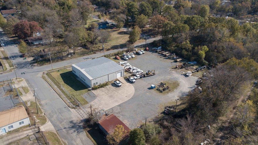 Commercial Steel building 12 years old located in Downtown LR. Fully fenced with security entrance and 26+ parking spaces. 75x80. 6400 sq feet of offices and conference room. Included is 3,000 sq feet insulated warehouse space. Lots of potential. List agent must accompany showings. See documents.