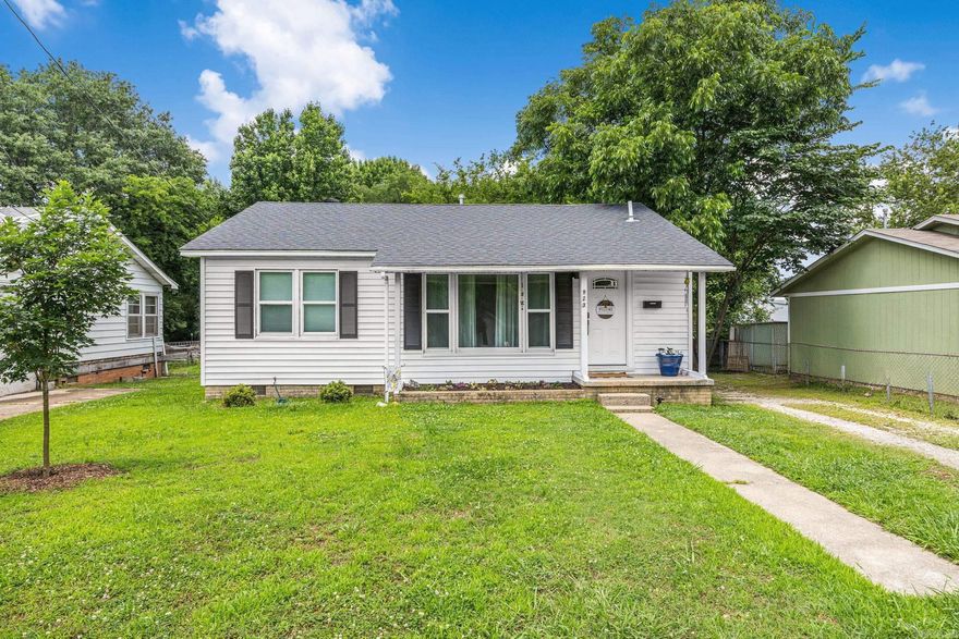 You'll want to see this charming Benton home which offers comfort, style, and convenience just minutes from I-30 access. Inside, you’ll find refinished original hardwood floors, abundant natural light, The remodeled kitchen features new cabinetry, granite countertops, subway tile backsplash, tile flooring, dishwasher, and range. Major upgrades include a 2024 HVAC system, new tankless hot water heater, newer roof, and updated windows for added efficiency and peace of mind. The bathroom was completely renovated in 2024. Includes a versatile shop building in the back complete with electric and water—perfect for hobbies, storage, or workspace needs. Conveniently located near shopping, dining, and schools, this Benton gem combines classic character with modern updates.