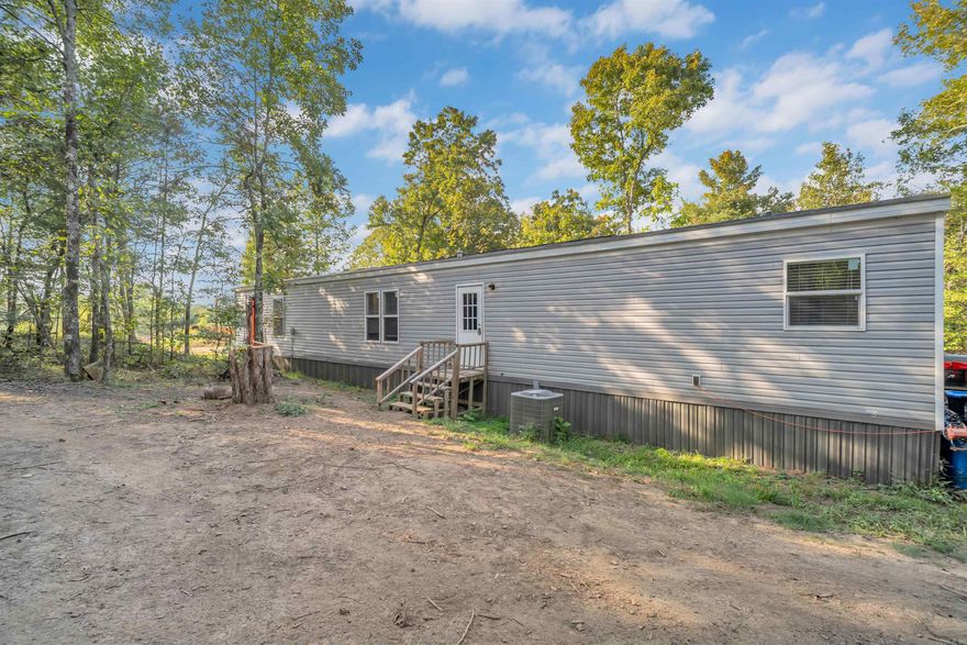 Escape to the country with this newer 3/2 single-wide mobile home situated on 14.31 acres of mixed timberland. Whether you're looking for a full-time residence, a hunting retreat, or a weekend getaway, this property has plenty to offer. The home features an open floor plan, comfortable kitchen & living areas. Outdoors, you'll find a blend of hardwoods and cedars that provide excellent cover for a variety of wildlife-making this a prime hunting property. The acreage also offers room for trails, food plots, or just enjoying the peace and quiet of your own private space. With ample acreage, a move-in ready home, and endless outdoor possibilities. This property is a great opportunity for anyone wanting land & privacy with a short drive to multiple public land hunting areas including Ed Gordon WMA, Galla Creek WMA and Ozark National Forest.