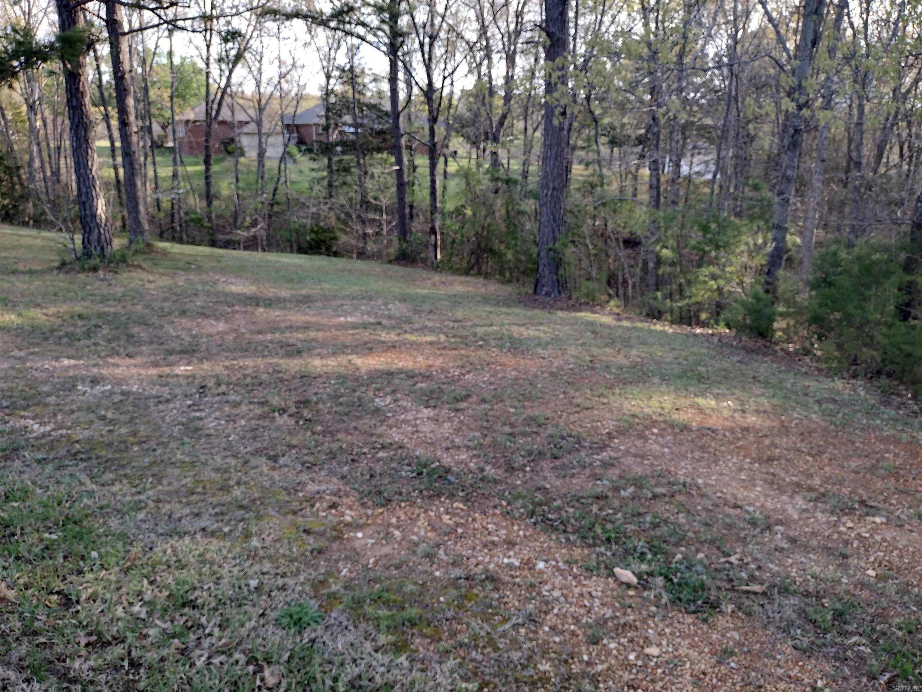Attractive lot in subdivision featuring a golf course adjacent and located in highly regarded neighborhood of lovely homes providing an excellent opportunity to build your dream home