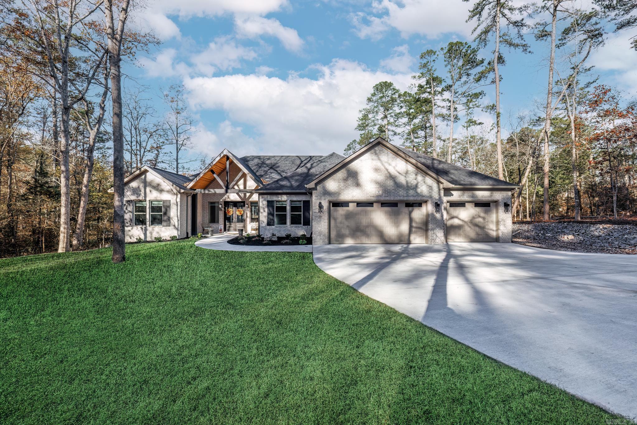 Don't miss your opportunity to have a newly built home that has barely been lived in. Beautiful custom built home on Lake Balboa with a picture perfect view of water from the moment you drive up. Stunning views greet you the moment you open the door taking in the walls of windows. Entertaining in this home is a breeze both inside and outside. Massive island in the kitchen allows you to flow from one area to the next. 10' ceilings and 8' doors thru out the home including a beamed and vaulted ceiling in the great room. Feature wall in the primary bedroom with concrete safe room. Divided bedrooms provide privacy desired. Office can be fourth bedroom or exercise area. Covered patio with wood burning fireplace for cool morning coffee or evening sunsets. Lake living enjoyed on lakeside patio or 97' of sea wall with a covered boat dock with lift. Stairs to lake give you easy access for swimming or kayaking. All the work is done - just come and enjoy life in Hot Springs Village! Features list in documents. AGENT REMARKS