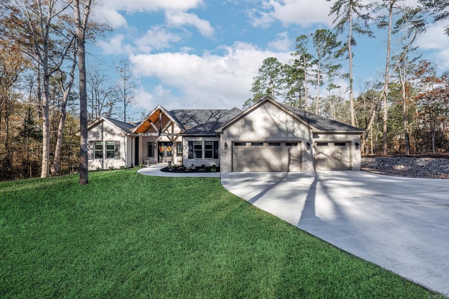 Don't miss your opportunity to have a newly built home that has barely been lived in. Beautiful custom built home on Lake Balboa with a picture perfect view of water from the moment you drive up. Stunning views greet you the moment you open the door taking in the walls of windows. Entertaining in this home is a breeze both inside and outside. Massive island in the kitchen allows you to flow from one area to the next. 10' ceilings and 8' doors thru out the home including a beamed and vaulted ceiling in the great room. Feature wall in the primary bedroom with concrete safe room. Divided bedrooms provide privacy desired. Office can be fourth bedroom or exercise area. Covered patio with wood burning fireplace for cool morning coffee or evening sunsets. Lake living enjoyed on lakeside patio or 97' of sea wall with a covered boat dock with lift. Stairs to lake give you easy access for swimming or kayaking. All the work is done - just come and enjoy life in Hot Springs Village! Features list in documents.  AGENT REMARKS