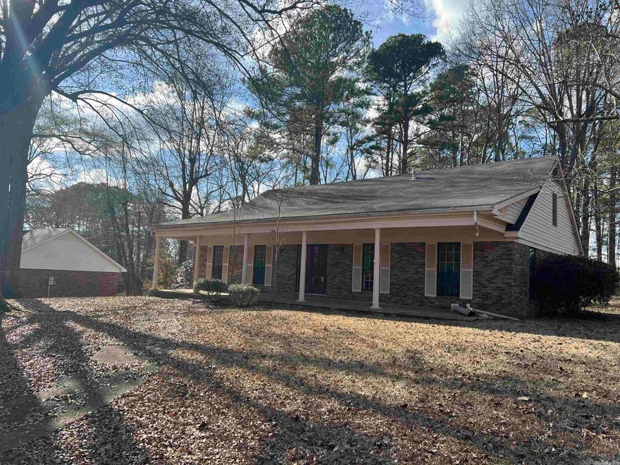 Price reduced - Home in need of some TLC, however lots of good things going on for this property.  It is sitting on 2 beautiful city lots! This 3 bd, 2.5 bath home is in a great neighborhood in Arkadelphia.  Master bed and bath downstairs with a 2 bdrm, Jack & Jill style, upstairs.  Plenty of storage throughout including 2 locations in the attic.  A formal living, which could be a 4th bedroom if needed, a separate dining room as well as a eat in kitchen. The beautiful fireplace makes the den a great place to relax.  A few updates are needed but the bones of this house are great.  It has been vacant for a few months and is ready for its new owners. Space can be converted to a 4th bedroom as well.