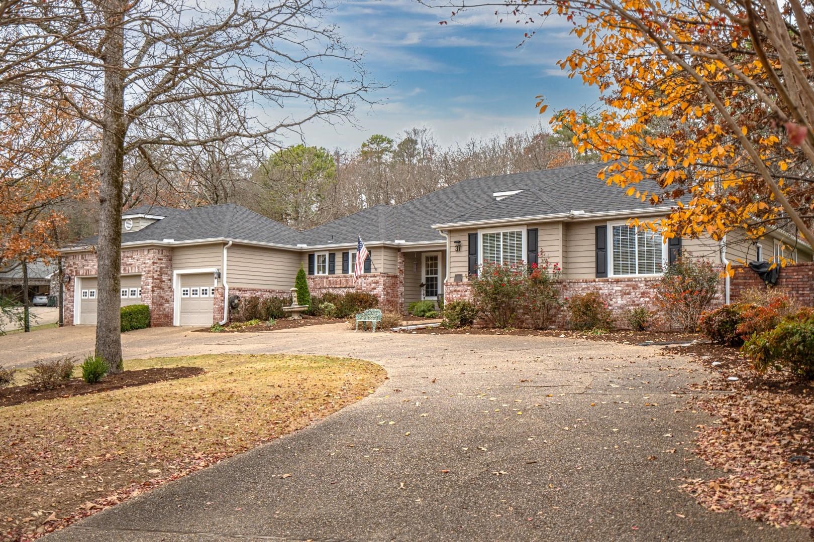 A TRUE FAMILY SHOWPLACE! Great location, Stonegate Shores Subdivision is a gated community with a pool, clubhouse, tennis court, trailer storage and a PRIVATE Boat Launch into Lake Hamilton! This custom designed 1995 home has approximately 2782 sq. ft. with 4 bedrooms and 2.5 baths that sits on a nice 1.5 acres lot. As you enter the front door you will embrace the entertaining floorplan with double crown molding, oak hardwood, tile and carpet floors, oversized closets, a gourmet kitchen with custom cabinets and granite countertops, top of the line stainless steel appliance, 5 burner gas range, double ovens, a walk-in pantry and butler's bar area with a sink. The home has an amazing double-sided fireplace and a three car garage. New roof in 2024. The fabulous screened-in back porch helps you enjoy the great outdoor space, whatever you need-you got it! This 1.5 acre lot is partially fence and is surrounded with the beautiful backdrop of a wooded area. Private-yet so close to all Hot Springs amenities. This upscale gated subdivision has a grand entrance with beautiful extra landscaping. SO MUCH TO OFFER! Everything and more to meet your needs and desires.