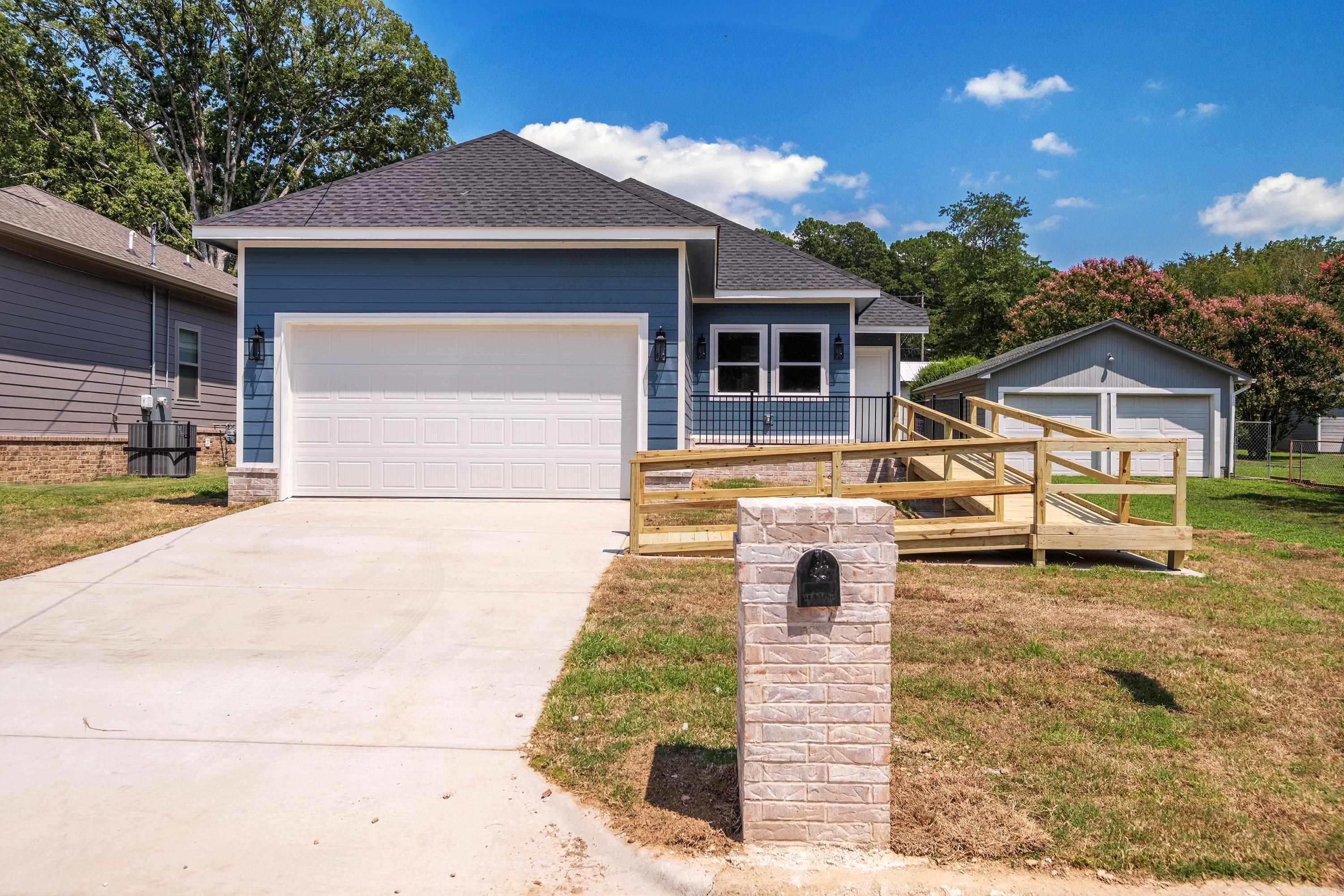 This newly constructed 3-bedroom, 2-bathroom home offers comfort, accessibility, and modern finishes. Featuring wood siding with a brick skirt, the property is designed to be handicap accessible, including a wooden ramp for easy entry. Inside, enjoy an open floor plan with laminate flooring throughout, ceiling fans in all bedrooms, and recessed can lighting in the family room and kitchen. The home is all electric and comes fully equipped with a refrigerator, washer, and dryer. Both bathrooms feature frameless LED anti-fog vanity mirrors with backlit and front lighting, and the primary suite includes a spacious walk-in shower. Additional features include a large lot and a rear deck, perfect for outdoor enjoyment. The City of Little Rock HNP will provide up to $20,000 subsidy with maximum loan approval on borrower. Must be primary residence and buyer must meet income requirements. Agents please see remarks.