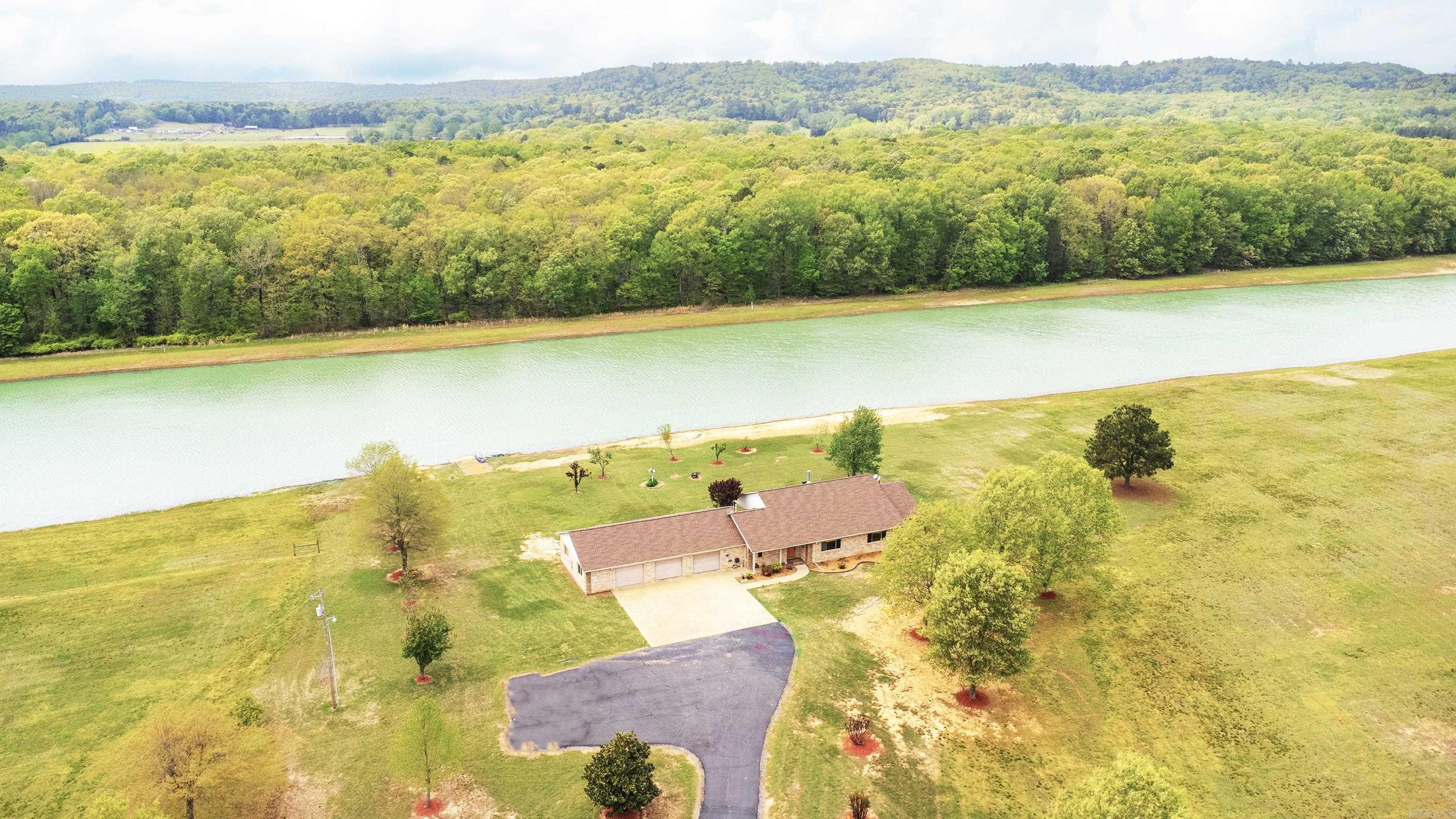 Stunning 52-Acre Lakeside Retreat with Modern Open-Concept Home Discover your private paradise on this expansive 52-acre estate, featuring a 10-acre fully stocked lake perfect for skiing, fishing, or serene relaxation. The level, partially fenced acreage offers endless possibilities for outdoor activities, equestrian pursuits, or future development. At the heart of this property lies a beautifully updated home with an open floor plan, showcasing fresh paint, new flooring, and a recently installed roof. The spacious interior flows seamlessly, ideal for entertaining or cozy family living. The oversized three-car garage, newly insulated and drywalled, provides ample space for vehicles, storage, or a workshop. Embrace the tranquility of lakeside living with modern comforts in this rare, move-in-ready estate. Schedule your private tour today!
