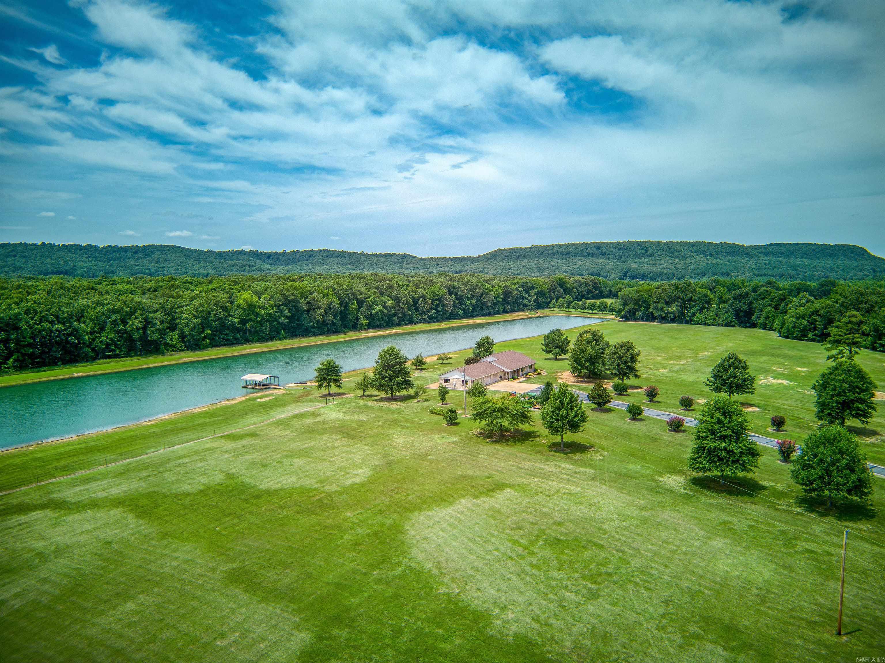 Stunning 52-Acre Lakeside Retreat with Modern Open-Concept Home Discover your private paradise on this expansive 52-acre estate, featuring a 10-acre fully stocked lake perfect for skiing, fishing, or serene relaxation. The level, partially fenced acreage offers endless possibilities for outdoor activities, equestrian pursuits, or future development. At the heart of this property lies a beautifully updated home with an open floor plan, showcasing fresh paint, new flooring, and a recently installed roof. The spacious interior flows seamlessly, ideal for entertaining or cozy family living. The oversized three-car garage, newly insulated and drywalled, provides ample space for vehicles, storage, or a workshop. Embrace the tranquility of lakeside living with modern comforts in this rare, move-in-ready estate. Schedule your private tour today!