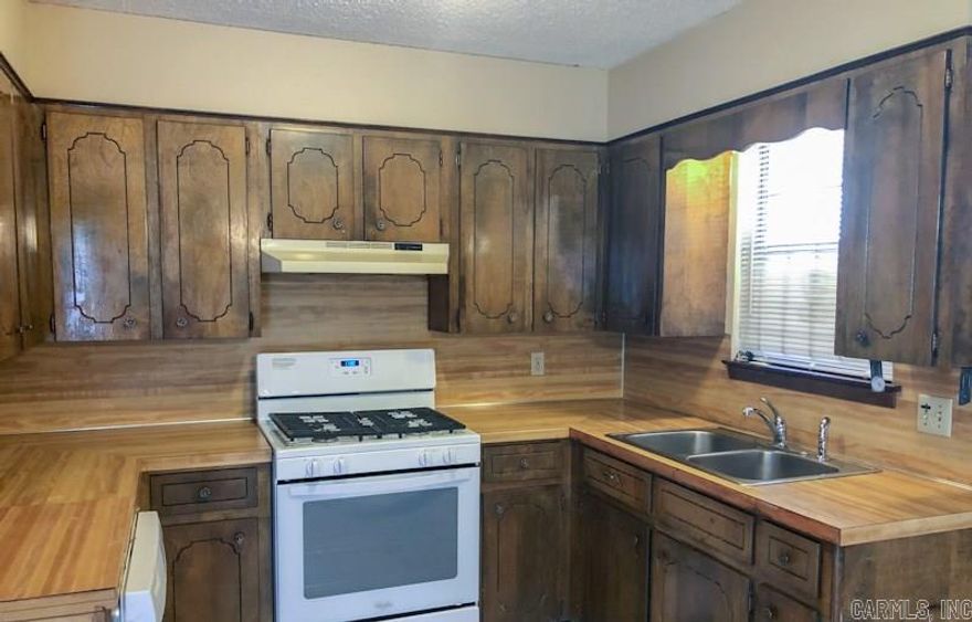 This three bedroom house is located on the corner of 65th and Carolina. It has a large fenced yard with a patio and a carport. It is carpeted throughout. There are also tile floors, ceiling fans and window coverings, central heat and air and washer/dryer connections. The kitchen is furnished with a gas stove, refrigerator and dishwasher. There is also a $33 per month alarm fee. The tenant will pay gas, water, and electric, and be responsible for yard care. Sorry, no pets and no smoking.