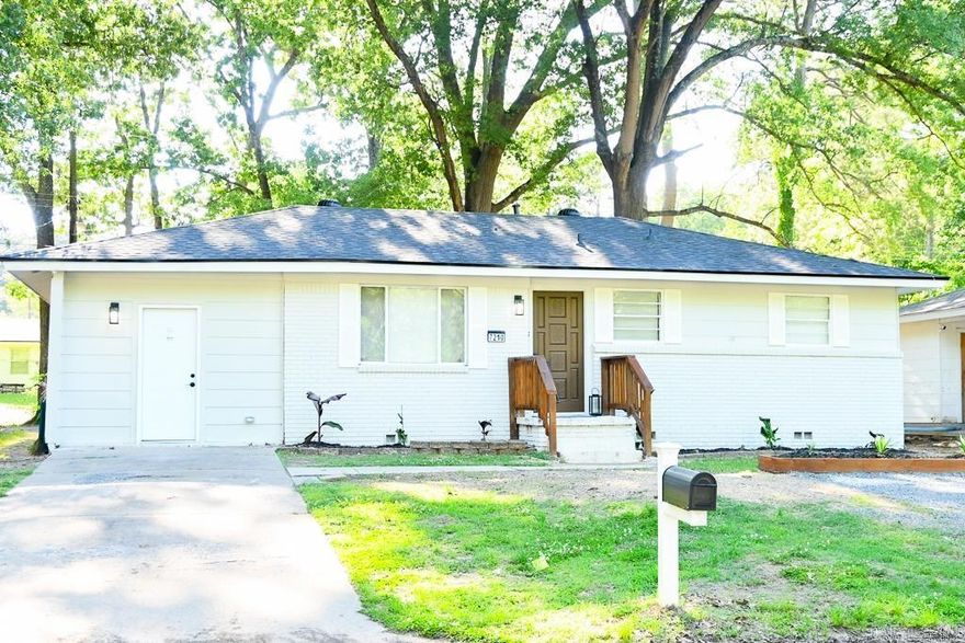 This thoughtfully renovated home is full of charm blending modern updates with a warm, inviting feel. Fresh interior and exterior paint, waterproof laminate flooring, and updated fixtures throughout create a comfortable atmosphere from the moment you walk in. The living room features a custom electric fireplace, while the updated kitchen offers new cabinetry, quartz countertops, gas range, pot filler, and modern finishes. The house also features a flexible bonus space that can serve as a second living area, office, playroom, hobby room, or potential non-conforming bedroom. The primary suite includes a private bath with tiled shower, an anti-fog LED backlit mirror, and a bluetooth speaker bathroom exhaust fan. Hall bath retains original layout but received updates that include flooring and a bluetooth speaker bathroom exhaust fan as well. Additional improvements include new roof (2026), plumbing (2026), and electrical updates (2026). Outside features include fresh landscaping, an additional parking pad, a huge wood planter box, and a newly built back deck perfect for relaxing and entertaining. There are so many enhancements — this home is best experienced in person!
