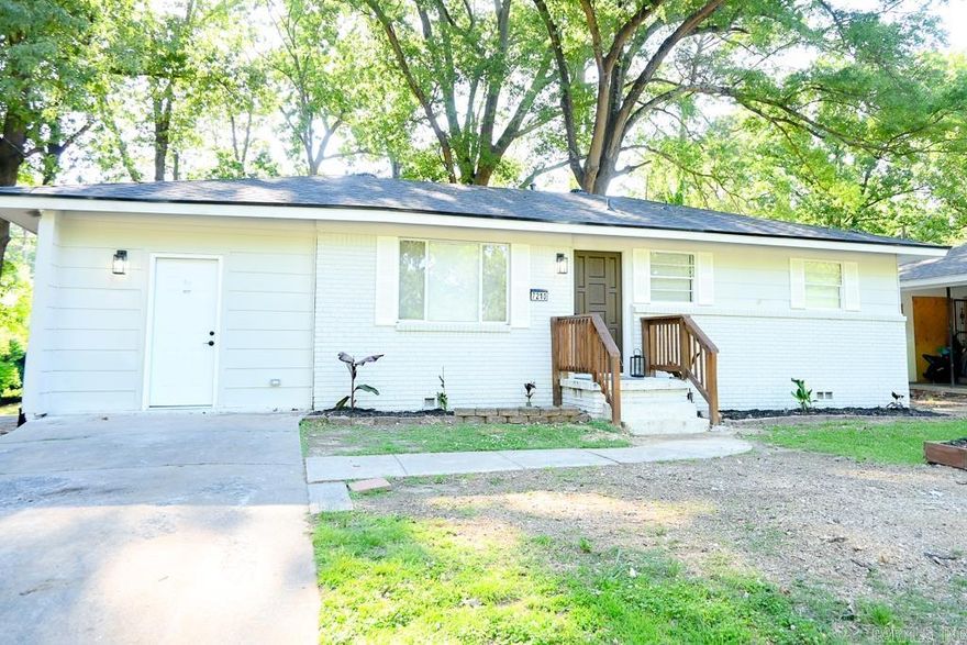 This thoughtfully renovated home is full of charm blending modern updates with a warm, inviting feel. Fresh interior and exterior paint, waterproof laminate flooring, and updated fixtures throughout create a comfortable atmosphere from the moment you walk in. The living room features a custom electric fireplace, while the updated kitchen offers new cabinetry, quartz countertops, a gas range, a pot filler, and modern finishes. The house also features a flexible bonus space that can serve as a second living area, office, playroom, hobby room, or potential non-conforming bedroom. The primary suite includes a private bath with tiled shower, an anti-fog LED backlit mirror, and a bluetooth speaker bathroom exhaust fan. The hall bath retains original layout but received updates that include flooring and a bluetooth speaker bathroom exhaust fan as well. Additional improvements include new roof (2026), plumbing (2026), and electrical updates (2026). Outside updates include fresh landscaping, an additional parking pad, a huge wood planter box, and a newly built back deck perfect for relaxing and entertaining. There are so many enhancements — this home is best experienced in person!