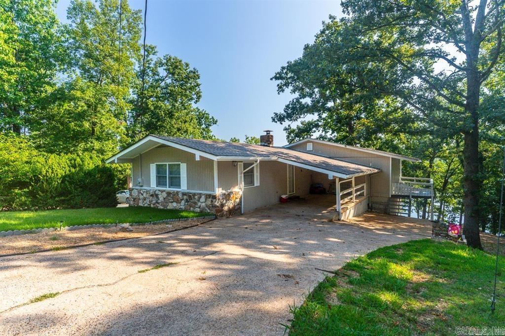 Welcome to the market 111 Lakeshore Dr. in Cherokee Village, Arkansas! Looking for your lakefront getaway? Look no further! Kick back on your private Dock and enjoy breathtaking lake views with a sunset backdrop. Offering almost 1,950 sq ft of flexible living space, this beautifully updated lakefront property sits on 0.48 acres with direct access to the lake via your private boat dock. This 3 bed, 3 bath home (or 2 beds + den) is an open-concept layout with large sliding glass doors, a bright eat-in kitchen with white cabinets, and breakfast bar. The spacious main-level primary suite features its own mini-split system and beautiful lake views. The lower level includes newer flooring and opens directly to the lake—ideal for guests or rental income. Step outside to a newly updated deck with outdoor seating, a heater, TV, and grill. All-electric home with central cooling. Established Airbnb history plus access to community amenities: golf, pools, marina, and more!