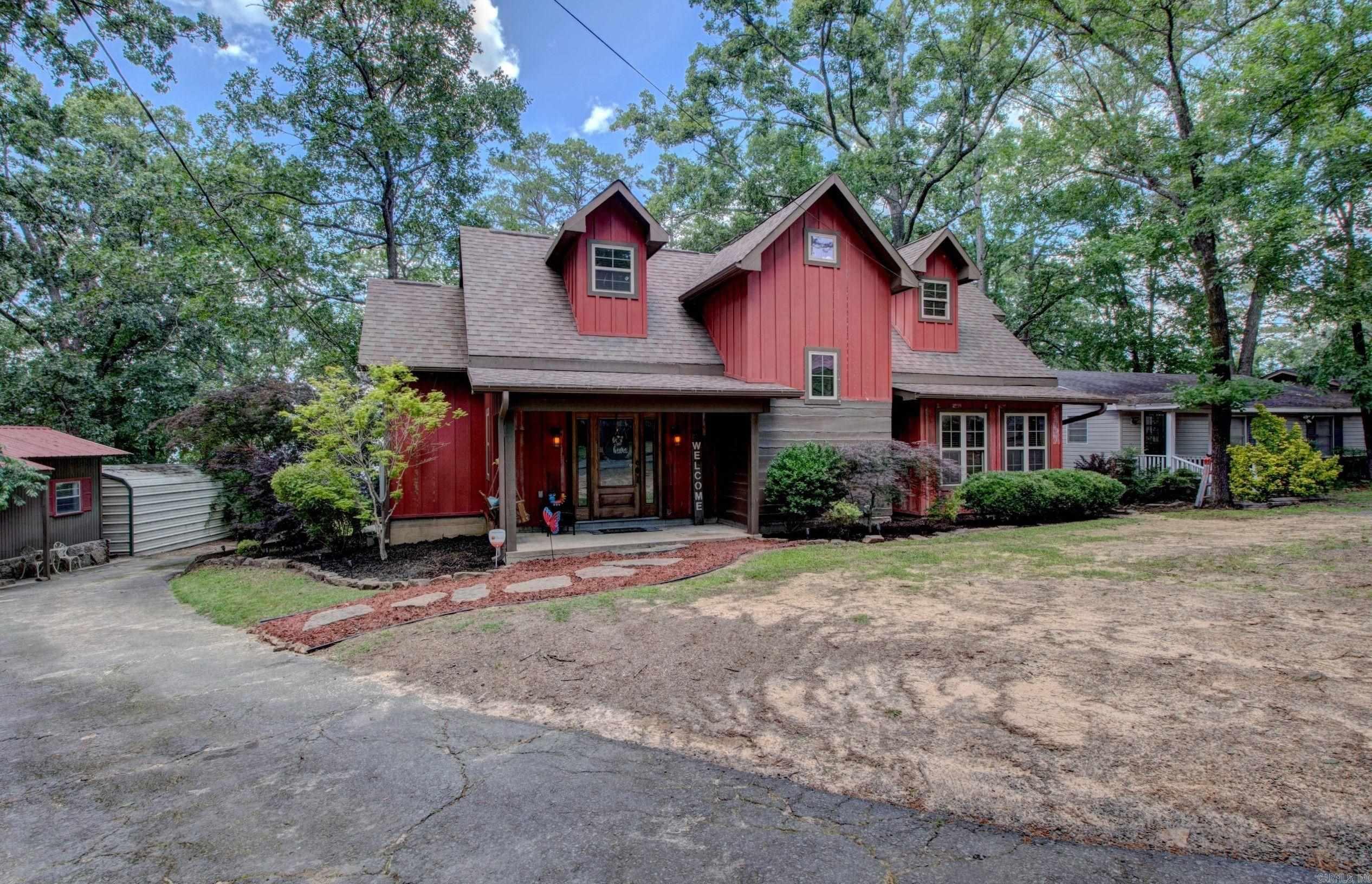 Welcome to market this beautiful lakefront home that offers everything you need for comfort, convenience, and investment potential. Brand new septic system! The open-concept layout features a split floor plan, a spacious upstairs bonus room, stunning flooring throughout, and a cozy wood-burning rock fireplace. The kitchen is complete with a granite tabletop island, breakfast bar, and plenty of room for gathering. The master suite has incredible lake views, a walk-in closet, and a private bath. Step outside to relax on the screened-in porch and take in the scenery. This home has 3 other spacious rooms, along with a loft. Adding to its uniqueness, this property includes two fully furnished cabins that are currently used as nightly rentals, providing an excellent income opportunity (produced over $24,000 in income in 2024). Positioned along a low white line, the home comes with its very own private tram to the water a rare and valuable feature. Don’t miss the chance to own this truly special piece of Greers Ferry Lakefront property. (The main home is 1841 Sq ft, each cabin is approx 300 sq ft.)(Home is 4 bed 2 bath, each cabin one bed one bath with kitchenette)