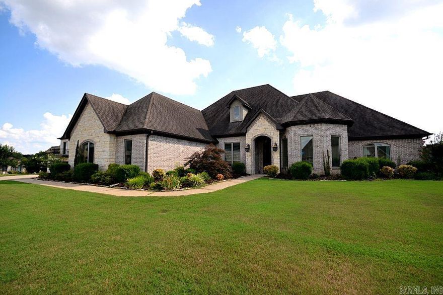 Experience elegance and comfort in this stunning 4-bedroom, 3.5-bath home, featuring a 5th room that offers breathtaking lake views—perfect for a home office or additional bedroom. Nestled in a prestigious gated community, this property sits on a flat, nearly half-acre lot in the highly sought-after Hurricane Lake Estates. Designed for convenience and entertaining, enjoy all main living areas on the first floor, with a spacious bonus room upstairs. The expansive covered patio with a cozy fireplace creates the perfect outdoor retreat.  Kids of all ages will delight in everything this neighborhood has to offer.  Community is strong here!   Located just minutes from the interstate and top local amenities, this home offers both luxury and lifestyle. Don't miss the opportunity to own a piece of paradise!