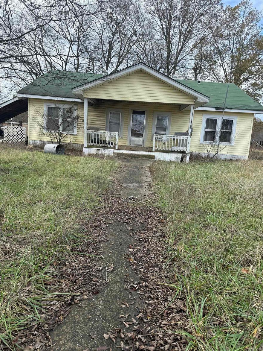 Great investment opportunity offers a fixer upper house, functional shop building and approx 80 acres of land. Property is mostly pastureland, nice 30x60 shop building with concrete floors and electricity, two large roll up doors with separate access door.  Property has some fencing, several ponds and a cattle corral.  Home is in need of a little TLC but with great potential.  Contact our office for more details.