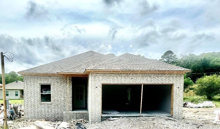 A LANCE LEVI CONSTRUCTION- New Quality Built Home!! Immaculate, new construction home is a true showcase of modern luxury and craftsmanship.This 3-bedroom, 2-bath all electric home, including the water heather & central heat, offers the perfect blend of style, comfort, and functionality. With luxuryvinyl plank flooring by Shaw and granite/quartz countertops, in kitchen and baths, the interior is designed with an elegant, contemporary feel. The homefeatures 9-foot ceilings that create an airy, open atmosphere, while insulated doors and walls enhance energy efficiency. The primary suite is a privateretreat, complete with a luxurious walk in shower. The exterior is equally impressive, with a striking brick facade with vinyl soffit & metal fascia, and afiberglass front door that provides both durability and curb appeal. Enjoy the convenience of a 2-car garage with insulated walls & doors, a covered backpatio, and a sprinkler system on its own meter, ensuring the lush landscaping is always well-maintained. Whether you're looking for a stylish new home or apractical space with all the modern amenities, this property is a must-see. Schedule a tour today to experience the comfort and quali