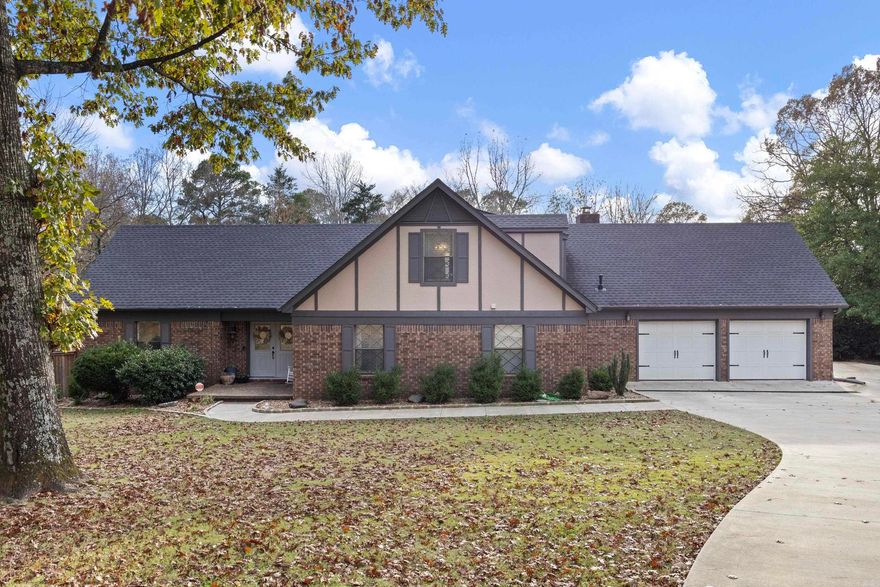 Russellville Arkansas 4BR/4BA two-story home on 1.6 acres! Flexible layout with 2 primary suite options. Filled with space and bright natural light throughout. Large kitchen with view of the massive fireplace, tons of cabinet space. Sun room/exercise room is so unique and great choice for those who love to entertain!   Enjoy the outdoors on the 850 square feet composite deck - great for entertaining or just enjoying nature with tons of green space around. Sitting in a cup-de-sac in a beautiful neighborhood!   Space, comfort, versatility in this amazing home!