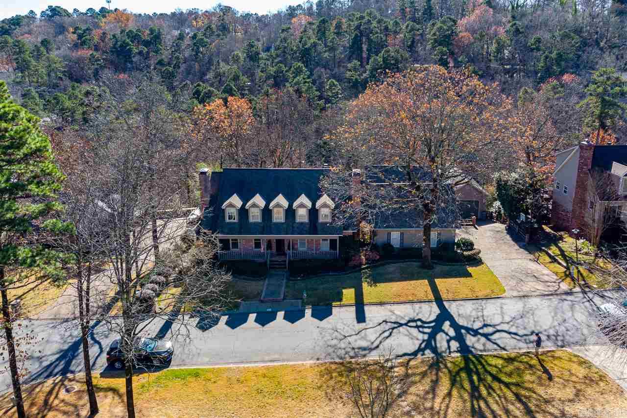 Special family home w/ den, game room, media room w/wet bar, exercise room & living room w/ wet bar. Master on main level.  6 car garage/capacity, green house,workshop & cedar closet.  Large deck overlooking lovely landscaping & pond. 3 fireplaces & large eat in kitchen. Chandeliers in library & dining room  & foyer  &  rug in dining rm. excluded. Wonderful detailing on the trim work throughout.  There are hardwood floors, & gracious foyer. Has natural gas generator & alarm system. On a quiet cul-de-sac.