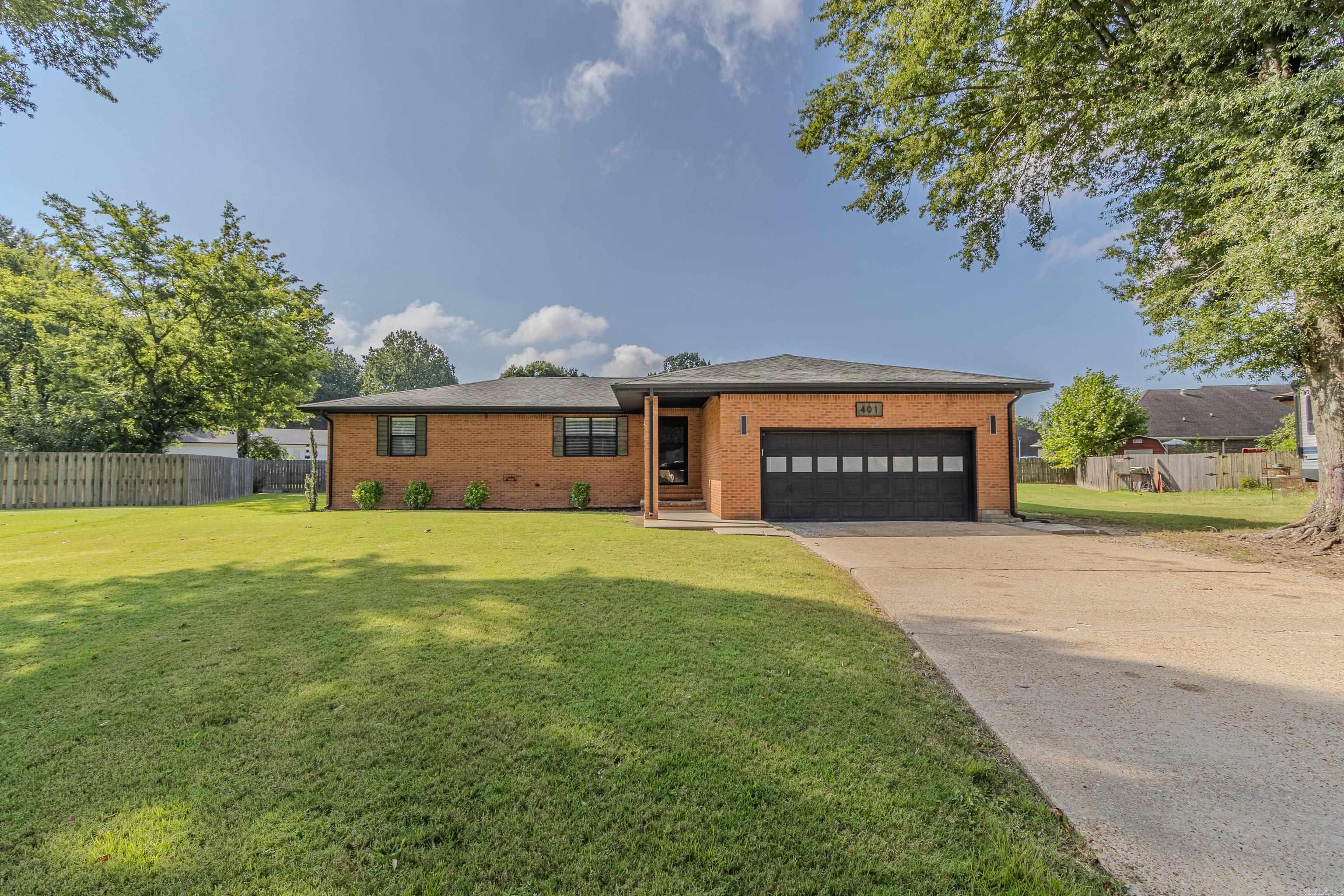 This all-brick home features a modern exterior with fresh shutters, a newly painted garage door, updated exterior lighting, and a new roof in 2023. Inside, the semi-open floor plan offers a formal dining area and a spacious kitchen with new custom cabinets and epoxied countertops. Recent updates include new flooring, trim, painted ceilings, and fresh paint throughout, along with all new lighting, switches, outlets, faucets, door handles, and mini blinds. The split-bedroom layout provides privacy, while the primary suite includes double closets. A bright sunroom extends the living space, and a detached shop offers room for projects or storage. Additional improvements include a re-insulated attic, painted garage interior, and refreshed exterior doors, gutters, and soffit, making this home stylish, functional, and truly move-in ready.