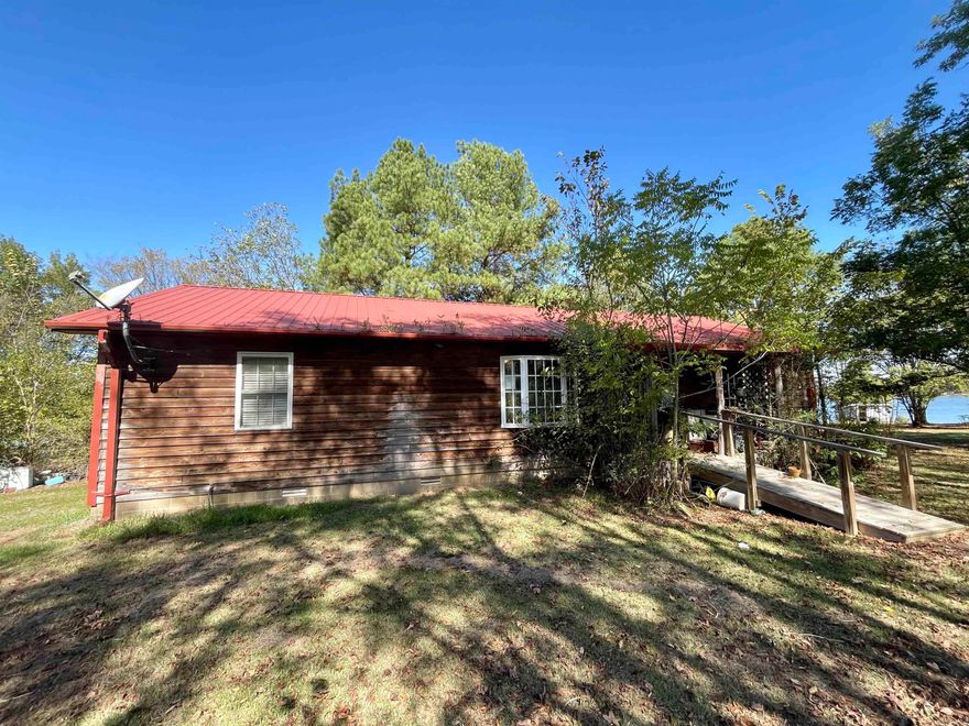 Charming 3 bed, 2 bath lake house on Lake Overcup. This serene retreat offers a tranquil escape with its picturesque surroundings. The property boasts a spacious layout, perfect for accommodating your family's needs. Enjoy the breathtaking views of the lake from the comfort of your own backyard. This home presents an incredible opportunity to customize and create your dream lakeside oasis. Property includes an insulated 30X30 that has electricity and water to it. Don't miss out on this rare find! Agents see remarks.