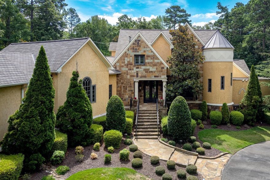 Custom built estate in gated exclusive Chenal Downs. Beautiful 5 acre property includes peaceful pond, flagstone in-ground pool with outdoor fireplace, hot tub spa, grill and firepit - entertainers dream. Chef's kitchen - Viking appliances, pot filler, 6 gas burner, ice maker, wine frig, and warming drawer. Versatile floor plan with 3 living areas on main level. Gorgeous sun room overlooks pond, v-groove wood ceiling with wet bar, craft room and theater room. Primary suite has hardwoods, onyx counter tops, roman shower. Upstairs private in-law or teen quarters has mini-kitchen. Separate stair cases for privacy - oversized suites upstairs with en-suite baths. Lush landscape, sprinkler, side load 4 car garage (approx. 1095 sq ft). Meticulously maintained - see list under documents.