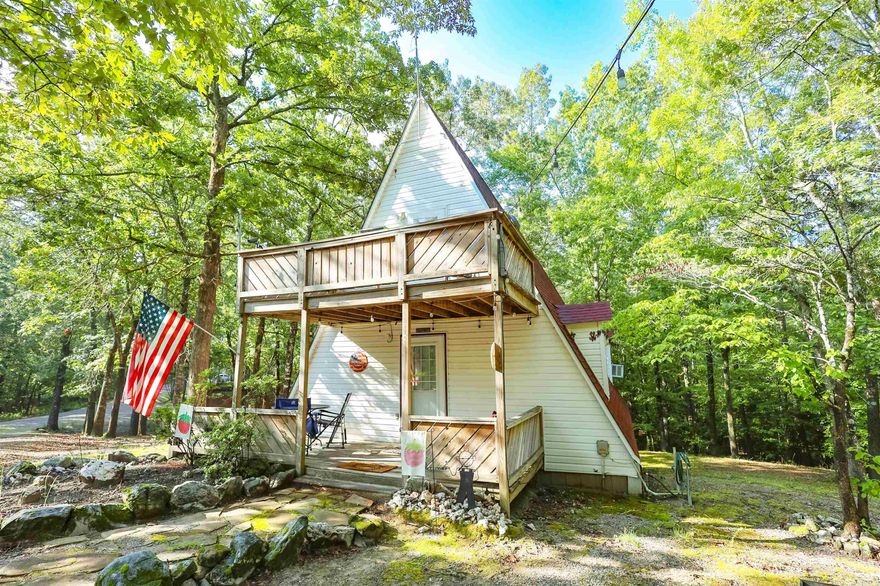 Discover this charming fully furnished A-frame on almost an acre, just three-quarters of a mile from the boat launch and swimming areas at Twin Creeks on Lake Ouachita. Offering 900± sq ft of living space, the open-concept first floor includes a kitchen, dining, and living area, plus a full bathroom and laundry. Upstairs, you’ll find a bedroom with a full bath and two additional sleeping lofts, providing flexible space for guests or weekend stays. The home is designed to comfortably accommodate up to six adults. Features include a 250-gallon propane tank, walk-in crawl space with 40-gallon water heater, gas heat, window unit AC, and city water with septic. A new roof was installed in 2019, adding to the property’s value and appeal.