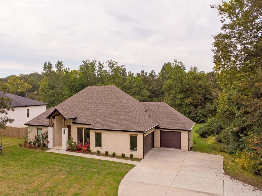 Situated on 1.4 acres in Benton, this beautifully crafted 2023 custom home offers an impressive combination of space, style, and thoughtful design. With 5 bedrooms, 4.5 baths, and over 3,300 square feet, there’s room for everyone to live and entertain comfortably!  Designed with privacy in mind, the split layout places the primary suite in its own secluded wing—featuring a spa-inspired bathroom with a soaking tub, oversized walk-in shower, generous closet space, and a built-in storm shelter. On the opposite side of the home, you’ll find four more bedrooms, two with private ensuite baths and two with a convenient Jack-and-Jill setup.  At the heart of the home, the open living, dining, and kitchen areas create a welcoming space perfect for gatherings or everyday life. The kitchen is complemented by a large walk-in pantry, while a nearby half bath is ideal for guests.  Additional features include a spacious laundry room with sink and folding area, and a 3-car garage.  Step outside to enjoy the covered back porch, offering a peaceful place to relax. Combining modern comfort with a quiet setting, this home delivers the best of both worlds!  AGENTS SEE REMARKS!