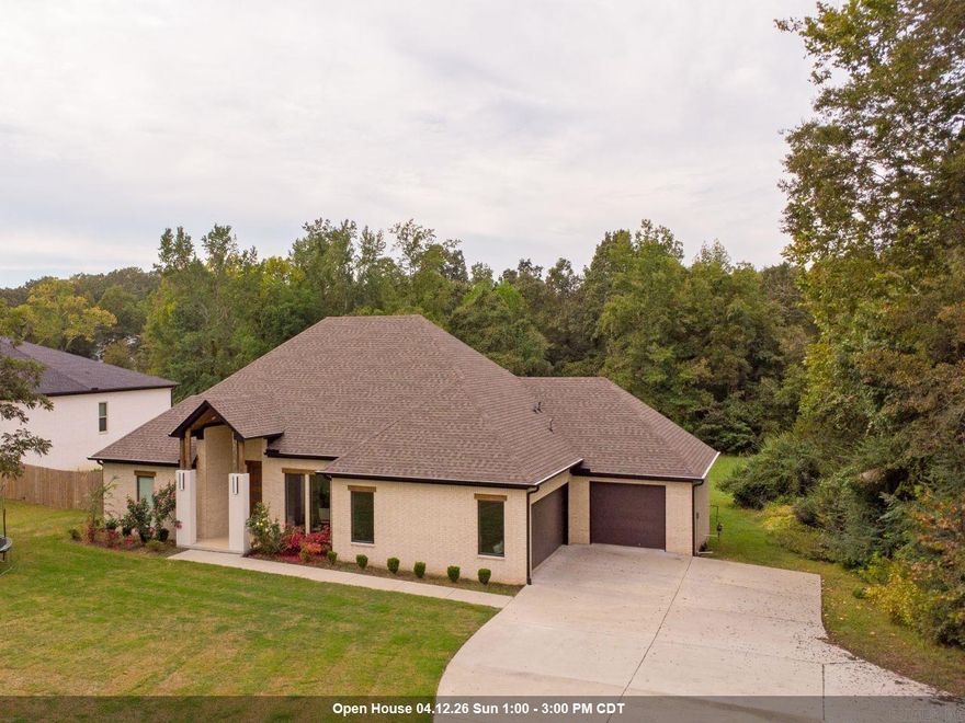 Situated on 1.4 acres in Benton, this beautifully crafted 2023 custom home offers an impressive combination of space, style, and thoughtful design. With 5 bedrooms, 4.5 baths, and over 3,300 square feet, there’s room for everyone to live and entertain comfortably!  Designed with privacy in mind, the split layout places the primary suite in its own secluded wing—featuring a spa-inspired bathroom with a soaking tub, oversized walk-in shower, generous closet space, and a built-in storm shelter. On the opposite side of the home, you’ll find four more bedrooms, two with private ensuite baths and two with a convenient Jack-and-Jill setup.  At the heart of the home, the open living, dining, and kitchen areas create a welcoming space perfect for gatherings or everyday life. The kitchen is complemented by a large walk-in pantry, while a nearby half bath is ideal for guests.  Additional features include a spacious laundry room with sink and folding area, and a 3-car garage.  Step outside to enjoy the covered back porch, offering a peaceful place to relax. Combining modern comfort with a quiet setting, this home delivers the best of both worlds!  AGENTS SEE REMARKS!