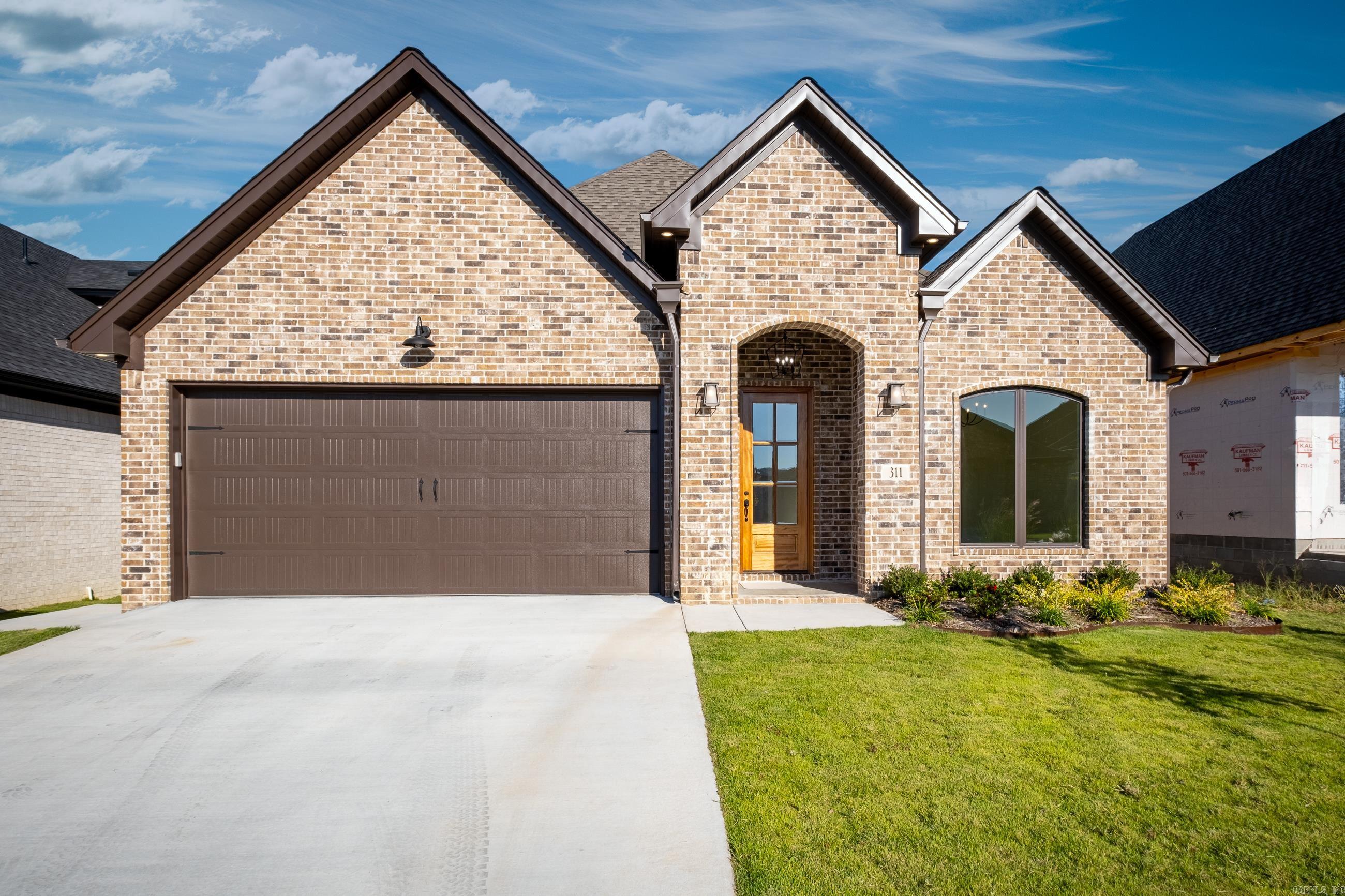 NEW CONSTRUCTION!! BUILDER OFFERING A LOWER INTEREST RATE WITH A 2/1 MORTGAGE BUYDOWN. This highly desirable home is located in Chenal's Fletcher Ridge Subdivision. This 3BR/3BA retreat offers a spacious kitchen, tankless hot water heater, walk-in pantry and 2 car garage. Outside features include covered patio with exterior closet for grilling accessories, sprinkler system with zoysia sod and gutters. Prewired for external security cameras and 220 wiring in garage for electric vehicle. Backs up to beautiful green space with fully fenced back yard. Conveniently located to West Little Rock amenities. This home will be your favorite place to call home!