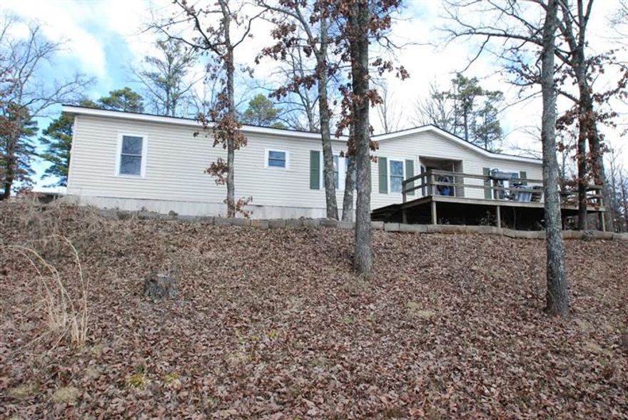 Peaceful, easy feeling & country living. 3/2 modular overlooking 5.5 acres of wildlife & woods with fruit trees. Hunt out your back door. Rock fireplace w/ gas logs. Big kitchen. Dining area. Breakfast bar. Whirlpool tub in master bath with skylight. New double hung windows throughout. Roof 6yrs. New compressor & HVAC. Propane & well water. Septic. 20x30 garage/bldg. Ark River just 1/2 mi away. UALR conservatory 1/2 mi away. Must turn on electrical at main before entering & turn off when leaving-See Photos