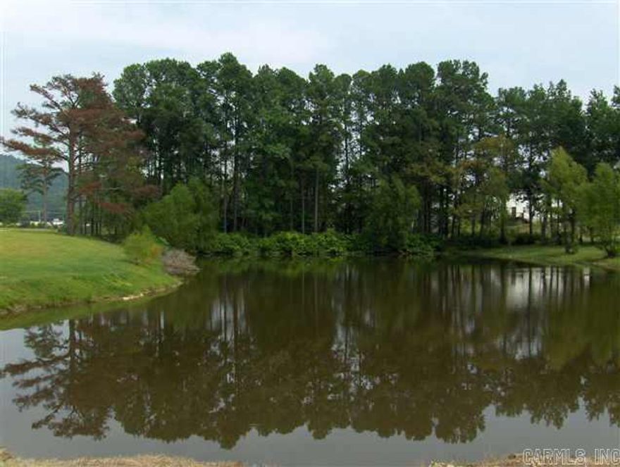 Lake Hamilton School District.  Adjacent to a highly successful, fully leased apartment complex.  Adjacent to new Harps Grocery Store.  Property is available and ready for construction.  Charming 10 +/- acres.  Would make great location for apartments, townhomes, condos, small subdivision, self-storage.  Sewer already installed in 2 locations; water and electric present.    Tract A on survey. Contractor/Seller will build to suit for sale or lease, ground lease, or sell outright.