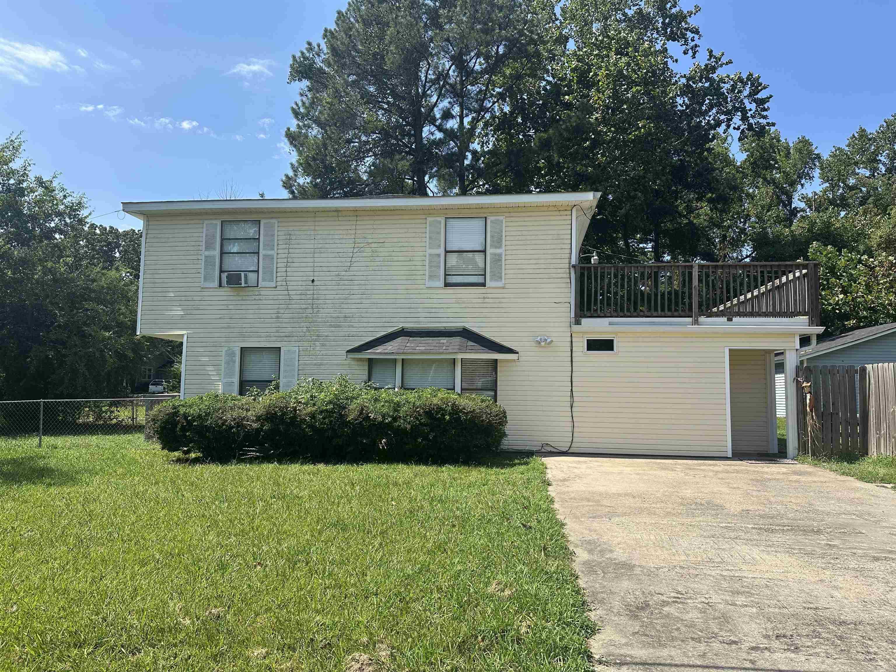 Investorās Dream! This 4-bedroom, 2-bath home offers endless potential on a spacious .58-acre lot. A brand-new roof (2024) provides peace of mind, while the flexible floor plan gives buyers plenty of options to update and customize. Upstairs, youāll find 4 bedrooms and a full bathroom with a tub. Downstairs features a living room, eat-in kitchen with gas cooktop (fridge stays!), a back room with ample closet space, plus a bathroom with walk-in shower and laundry area. The large addition can easily serve as a game room, second living area, or even a 5th bedroom. Additional highlights include central heat and air, a second-floor walk-out deck for outdoor living, and a free-standing garage thatās perfect for storage or a workshop. Being sold as-is, this property is a fantastic opportunity for investors, flippers, or handy buyers ready to unlock its full potential.