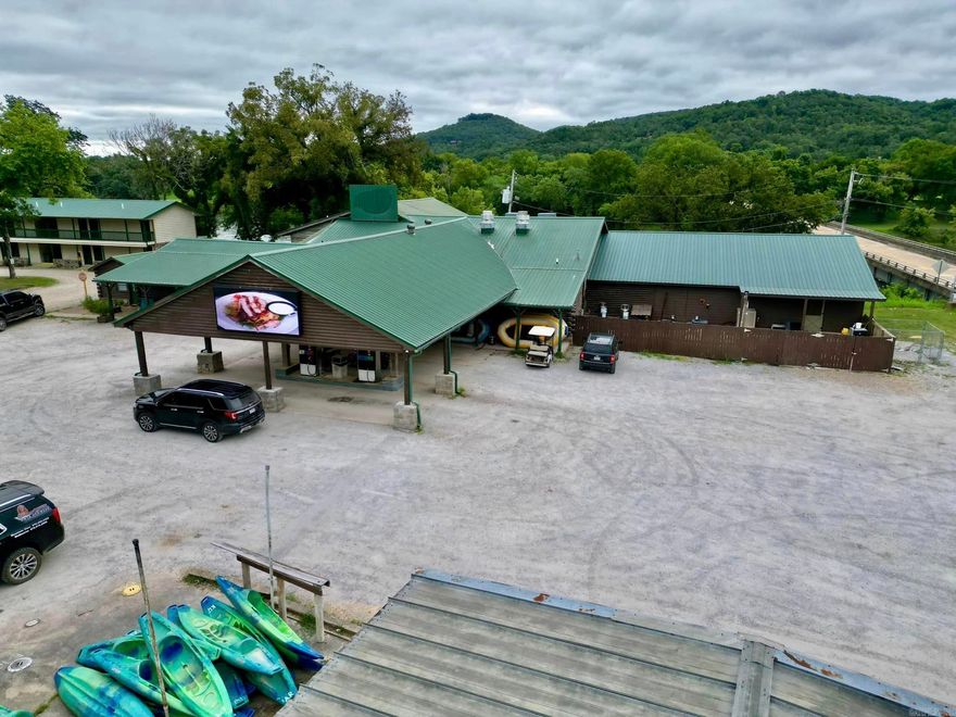 Anglers White River Resort. Featuring a restaurant, lodging, fishing, float trips and more! This one-of-a-kind property has river frontage on the incredible White River. The stunning resort includes a boat dock and restaurant with outdoor seating looking over the beautiful river. There is a 12-unit motel, 2 upstairs rentals over the restaurant, and one cabin beside the restaurant. Everything is situated together on 5 acres, all within 5 miles of downtown Mtn. View and Blanchard Spring Caverns.  This turn-key business opportunity is ready for you to step in and take over without ever having to miss a beat! Anglers' Restaurant has a full kitchen, party room, bar area, retail store and so much more! The retail store front has a gift shop, tackle, and food, plus gas pumps. Book your own fishing/ kayak boats or schedule a guided tour fishing experience. According to the owner there is a cap rate of 7.7%, records available. Call now so we can get you into your new business today!
