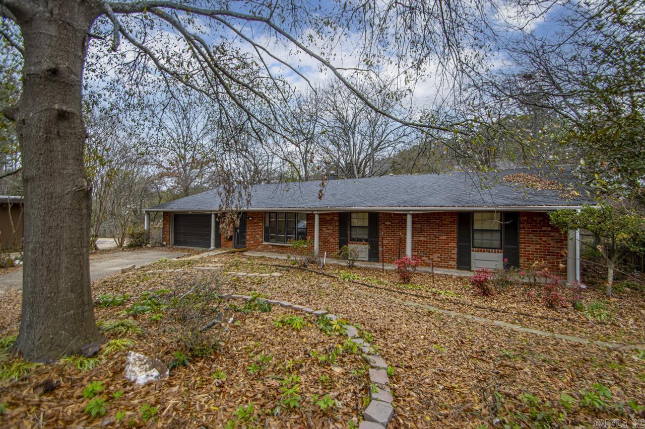 One level gardeners paradise with 4 bedrooms, 3 living areas complete with whole home generator - located on quiet Midtown cul-de-sac. Privacy all around with creek and extraordinary landscape. New appraisal of 2225 sq. ft. includes sunroom. Large brick fireplace separates living areas, new kitchen cabinets & backsplash. Newer roof, HWH 2020, HVAC 2016. Great for first time home buyers!