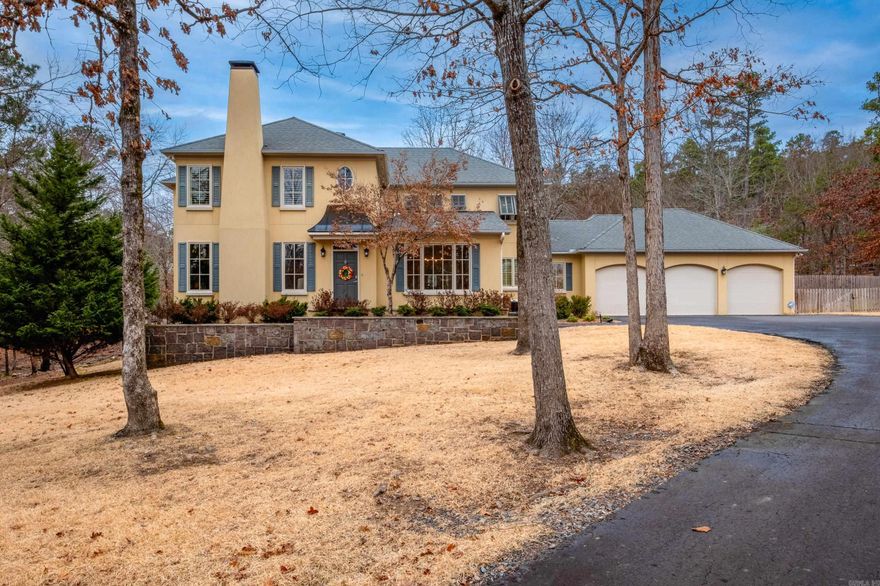 Traditional two story home on 5.58 acre lot in gated Somersett Estates. Hardwood floors throughout main level living areas create a warm, inviting feel. Formal dining room and office or formal living with wood burning fireplace off the front foyer. Spacious yet comfortable family room with rock surround wood burning fire place, built ins and wall of windows overlooking the backyard. Updated kitchen with stainless appliances, gas cooktop, island seating and casual dining area designed for everyday living and gathering. Large laundry and half bath on main. Primary suite offers a peaceful retreat with spa inspired bath, dual sink vanity, soaking tub beneath a large window, separate shower and generous closets. Upstairs includes two guest bedrooms with shared bath, one guest bedroom with hall bath access and bonus/game room providing flexible space. Three car garage with plenty of storage and mini split for heating/cooling. Expansive patio, terraced beds, storage barn, wood fencing and walking paths across the acreage offer room to relax, entertain and enjoy the outdoors. Come see!