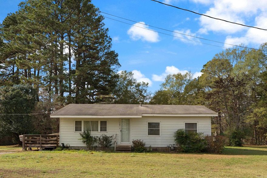 Well-maintained residence located in the established Eight Addition Subdivision of Sheridan. This 1,240-sq-ft home offers 3 bedrooms, 1 full bathroom, a spacious living room, kitchen/dining combination, and a separate laundry room. While the property has been cared for over the years, it presents an excellent opportunity for updating and personalization.  Situated on a generous lot, the property includes additional utility hookups suitable for a second residence, mobile home, or shop, offering valuable expansion or investment potential. A shop building is also present on-site and provides additional storage or workspace. There is also a wheelchair access ramp that is ADA compliant.  This home is ideally located just up the street from Sheridan Elementary, Sheridan Intermediate School, and Sheridan High School, and is convenient to all local amenities, including shopping, dining, and community services.