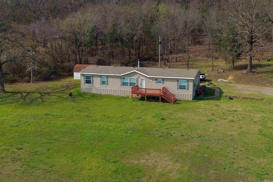 5.73 acres, mountain views, and private Pine Lake access just minutes from Mansfield. Built in 2018, this 4 bedroom, 2 bathroom home offers peaceful country living with space to spread out while still being close to town.  Inside you’ll find an open living, kitchen, and dining layout with abundant natural light. The home is all electric with central heat and air and includes a brand new tankless water heater installed in 2026.  The primary bathroom features an oversized 72 inch soaking tub, while the second bathroom includes a double vanity providing additional space and convenience.  Residents enjoy shared access to Pine Lake within walking distance. This private lake is available to residents only and is stocked with bass, catfish, and other species, making it a great place for fishing and relaxing outdoors.  The property offers a blend of open yard and surrounding trees with plenty of room for animals, gardening, or future improvements while maintaining privacy and quiet rural surroundings.  A rare opportunity to enjoy acreage, scenic views, and private lake access in a quiet Mansfield setting.