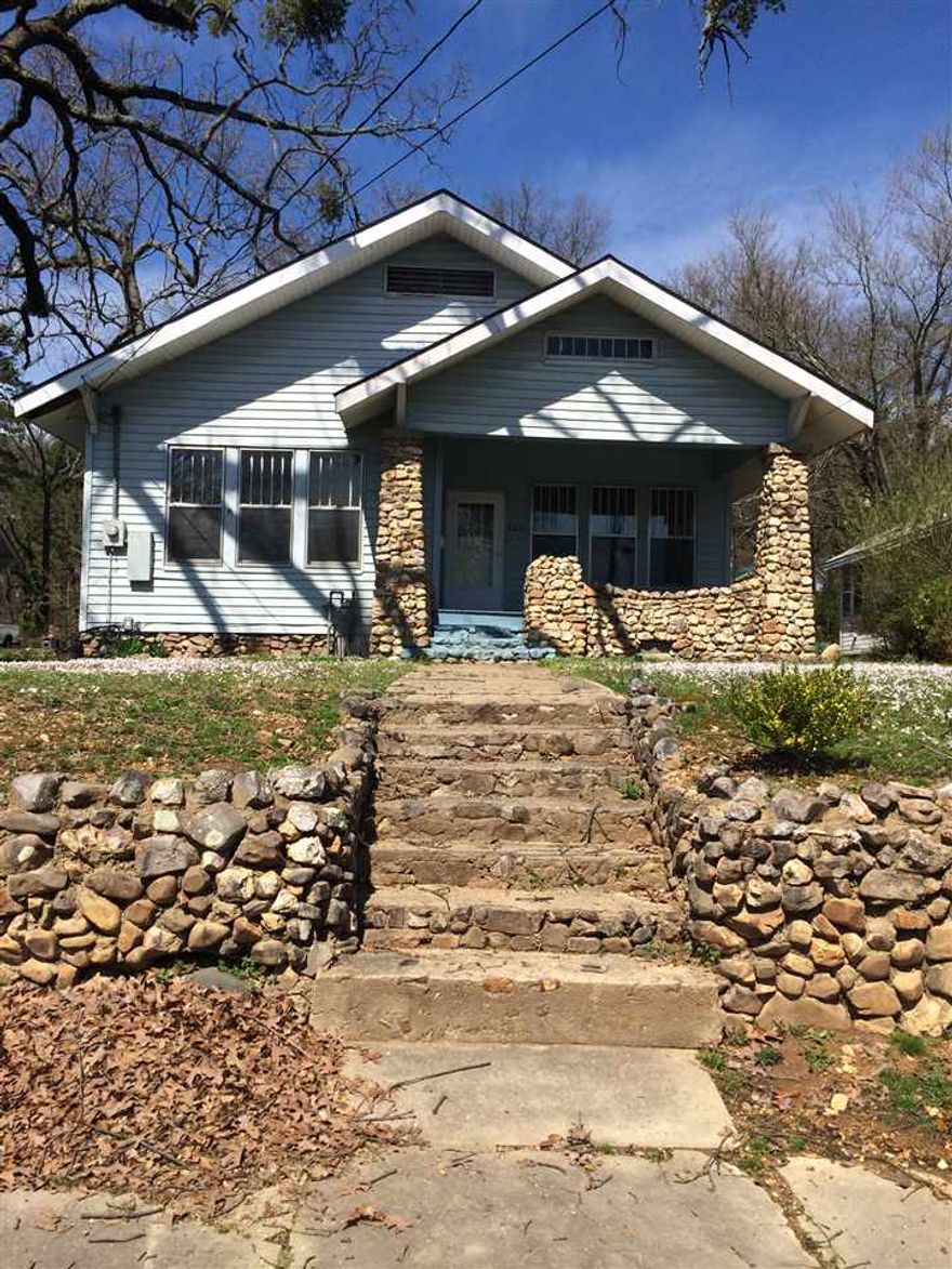 Lots of character and charm in this 1930 home in the Historic District. Original hardwood floors, High ceilings, fresh paint, leaded glass windows, French doors, 3 BR 2 BA 1522 SF. Great location and price for this little house, loads of potential! This would make a great rental.