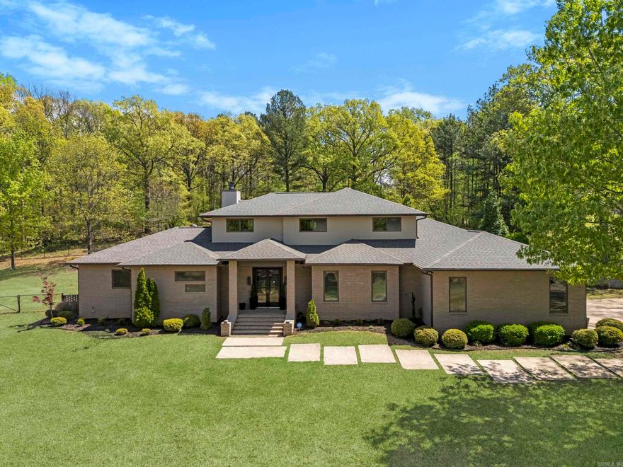 An Architectural Masterpiece on Crowley’s Ridge Wynne, Arkansas | 5,020 Sq Ft | 4–5 Bedrooms | 4.5 Baths | Private Pool Retreat Welcome to a home of rare distinction, gracefully perched atop Crowley’s Ridge. Upon entry, one is greeted by a grand room anchored by a striking wood-burning fireplace, elegantly clad and framed by custom-built cabinetry. Seamlessly flowing into the heart of the home, the designer kitchen is a culinary dream—showcasing dual islands, handcrafted cabinetry, custom concrete countertops, a 6-burner range, double ovens, built-in microwave, and a walk-in pantry. Ideal for both intimate and large-scale entertaining, the home also features a light-filled breakfast or keeping room, along with a formal dining space enhanced by an art niche. The primary suite is a sanctuary unto itself, complete with a serene private office and a lavish en-suite bath. Three additional bedrooms grace the main level, including a full guest suite with private bath and a thoughtfully designed Jack-and-Jill configuration. A chic powder room and laundry as well.  Head upstairs to discover a spacious family or game room, a full bath, bedroom/office. Outside a resort style pool awaits!