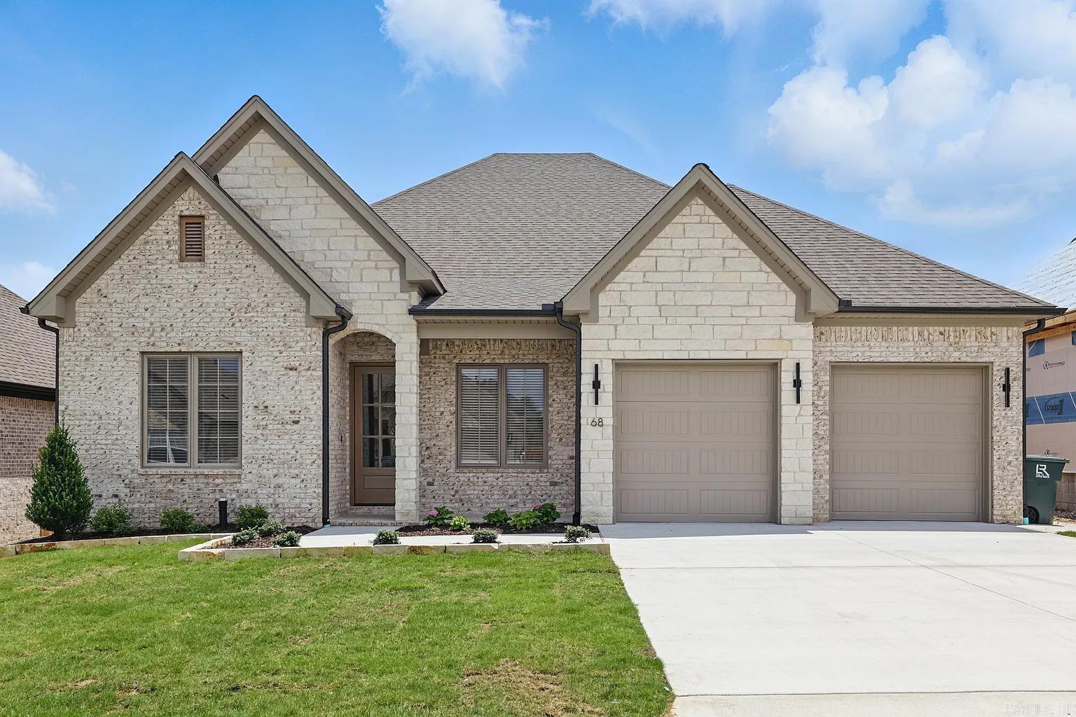 Welcome to Mountain Brook, West Little Rock’s most sought-after new community. This thoughtfully designed home offers 2,440 heated and cooled square feet, blending comfort and craftsmanship in every detail. The open floor plan creates a natural flow between the kitchen, dining, and living spaces, highlighted by a cozy fireplace and tray ceiling that enhance the warm, inviting feel. A dedicated office and three spacious bedrooms provide flexibility for both work and family life. The owner’s suite is a true retreat, featuring a spa-like bath with soaking tub, oversized walk-in shower, and custom closet with convenient access to the laundry room. Outdoor living is easy with a covered front and back porch, perfect for relaxing or entertaining. With custom cabinetry, quartz countertops, and tall ceilings throughout, this home is built to impress while maintaining everyday functionality. Mountain Brook is ideally located near Highway 10, minutes from The Ranch, shopping, dining, and the natural beauty of Pinnacle Mountain and surrounding trails. Estimated completion Spring 2026. *Photos shown are from a previous build of the same floor plan. Please ask about finishes and selections!