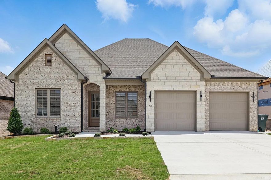 Welcome to Mountain Brook, West Little Rock’s most sought-after new community. This thoughtfully designed home offers 2,440 heated and cooled square feet, blending comfort and craftsmanship in every detail. The open floor plan creates a natural flow between the kitchen, dining, and living spaces, highlighted by a cozy fireplace and tray ceiling that enhance the warm, inviting feel. A dedicated office and three spacious bedrooms provide flexibility for both work and family life. The owner’s suite is a true retreat, featuring a spa-like bath with soaking tub, oversized walk-in shower, and custom closet with convenient access to the laundry room. Outdoor living is easy with a covered front and back porch, perfect for relaxing or entertaining. With custom cabinetry, quartz countertops, and tall ceilings throughout, this home is built to impress while maintaining everyday functionality. Mountain Brook is ideally located near Highway 10, minutes from The Ranch, shopping, dining, and the natural beauty of Pinnacle Mountain and surrounding trails. Estimated completion Spring 2026. *Photos shown are from a previous build of the same floor plan. Please ask about finishes and selections!