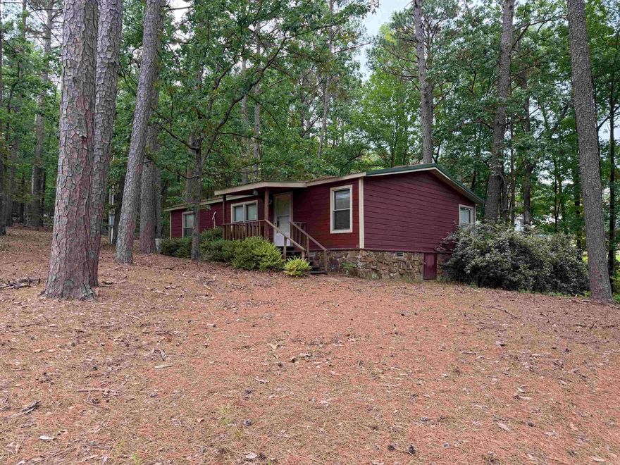 Nestled on 3 acres just minutes from Devil’s Fork Recreation Area, this 3-bedroom, 2-bath home offers the perfect blend of comfort, privacy, and convenience. Surrounded by mature trees providing plenty of shade, the property creates a peaceful country setting ideal for relaxing or entertaining. Enjoy spacious living areas, a functional floor plan, and room to roam both inside and out. Whether you’re looking for a full-time residence, weekend getaway, or investment opportunity near the lake, this property is a must-see! More pictures to come.