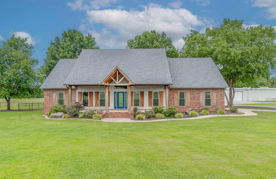 Welcome to this truly exceptional and rare property located in Greenbrier School District. Set on 4.58 acres behind a hard-wired gated entrance, this home offers the highest standard in privacy, function, and style—with 4 bedrooms, 2.5 bathrooms, an office, underground safe room, and two large shop buildings. Inside, the fully remodeled home features expanded dining area, granite countertops, custom cabinetry, real brick backsplash and new appliances, spacious master suite with a massive walk-in closet and underground heated/cooled safe room with electrical and storage. New flooring throughout, insulated windows and garage, and walk-up attic access with decking and fire alarm system as well as a hard-wired security system. The outdoor amenities are just as impressive with a 50x100 metal building with full bath, office w/ window unit, propane heater, floor drains, ceiling vents & fans, 50- & 30-amp service and generator hookup. 320-amp electrical service for property and whole-home generator. Additionally, a 40x 66' shop with RV parking space and lean-to for added storage, pipe fencing, chicken coop and raised garden beds. See agent remarks.