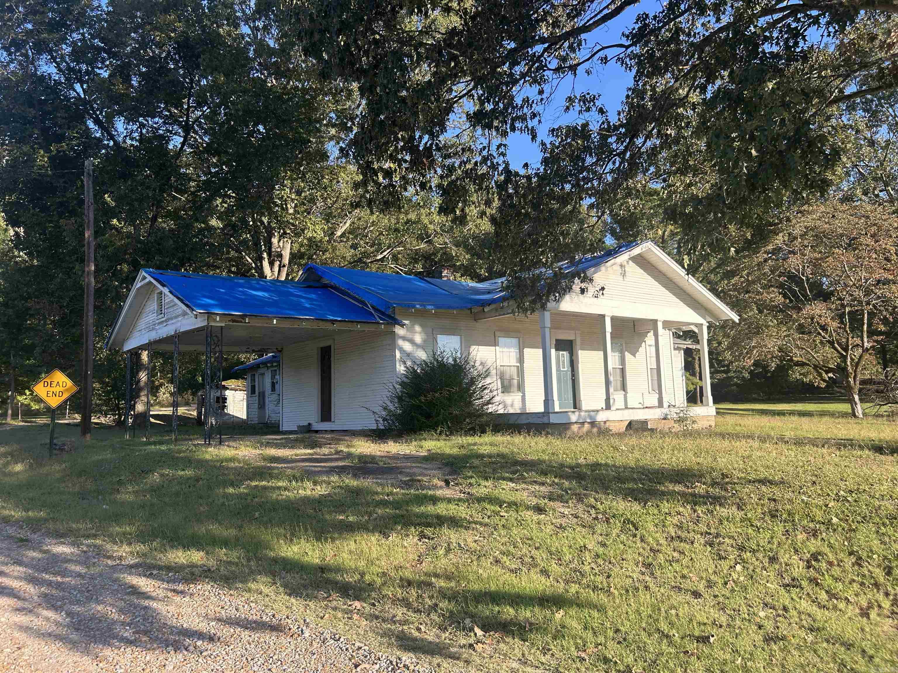 This AS IS home is perfect for a diyer / fixer upper! Open floor plan with over an acre with hwy frontage.