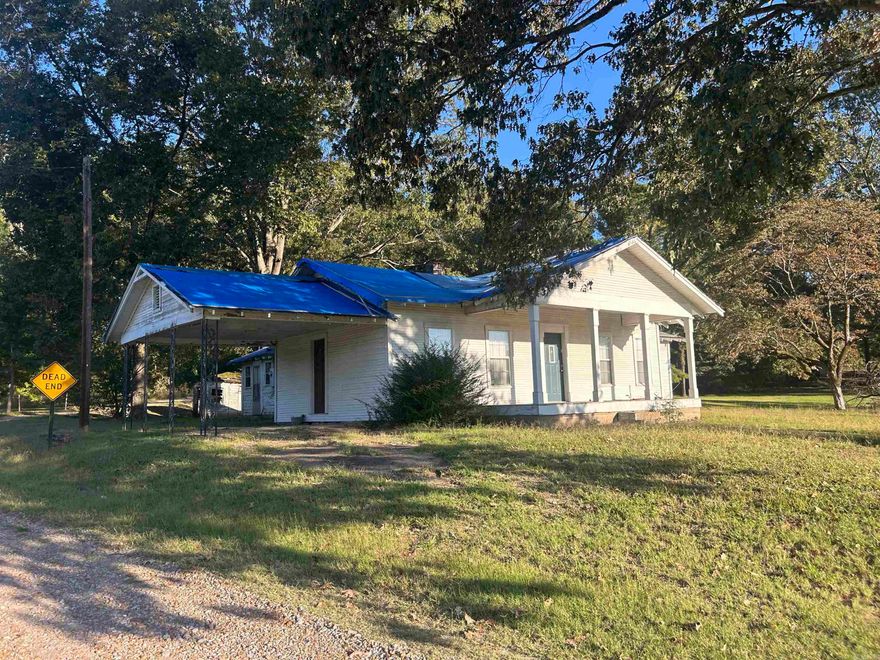 This AS IS home is perfect for a diyer / fixer upper! Open floor plan with over an acre with hwy frontage.