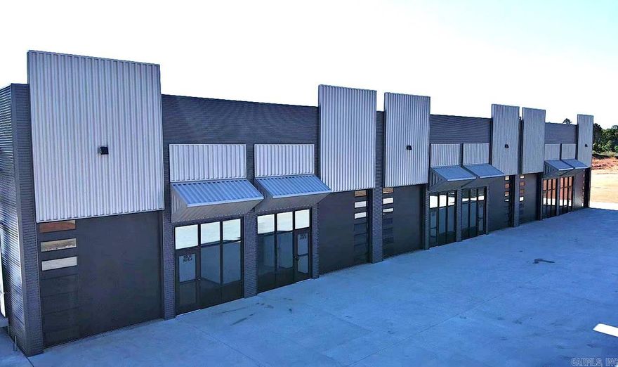 Exceptional LEASE OPPORTUNITY~FLEXSPACE with functional layout and amenities.  Welcome to your new way to combine WAREHOUSE, OFFICE and RETAIL SPACE all under one roof. Beautiful store front allows you to welcome customers and clients while combining a clean professional office layout with functional warehouse space.  An ideal space for a business that needs both administrative and light industrial capabilities in one location. Each unit is 25x70 and includes 10x10 Office space, and easily accessible bathroom with shower included. 2 Roll up doors (front & back) with higher ceilings allow more workspace with airflow. $1800 per month with 24 month lease required. Convenient to I-30, Walmart, Hospital, Shopping and more.