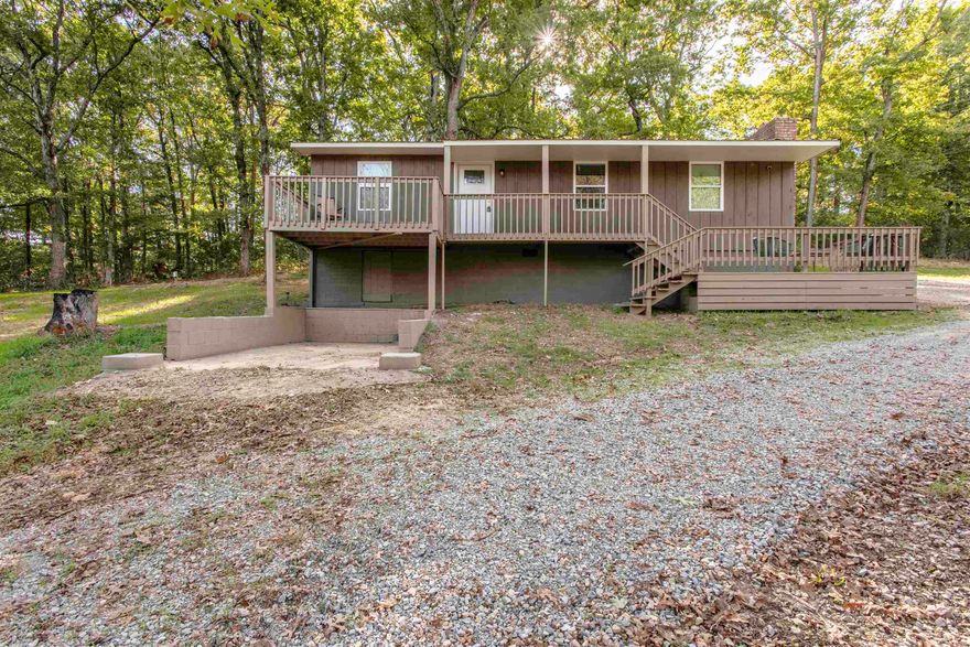 Peaceful Country Living on 5 Wooded Acres  Enjoy the quiet of the countryside without giving up convenience. This detached 3-bedroom, 1-bath home sits on 5 rolling, wooded acres along a paved road — no close neighbors, just trees and fresh air. The home has been well cared for, featuring updated windows, doors, and flooring, plus rural water service. Fiber internet is also available. All electric with woodburning fireplace.   Inside, you’ll find a comfortable layout with a bright sunroom that doubles as a laundry area — perfect for morning coffee or extra space to unwind. Step outside the front door to a staggered two-level front deck that looks out over the gently sloping land, ideal for watching wildlife or entertaining. 5 acres of wooded land provide a nice escape to play, watch wildlife and enjoy nature. 2 power line right aways located behind home within the acreage. This home would make a great starter home or if you are older and looking to down size this might be an option.   This property is listed for sale and owned by listing broker.   If you’re after privacy, elbow room, and a move-in-ready home surrounded by nature, this one’s a rare find.